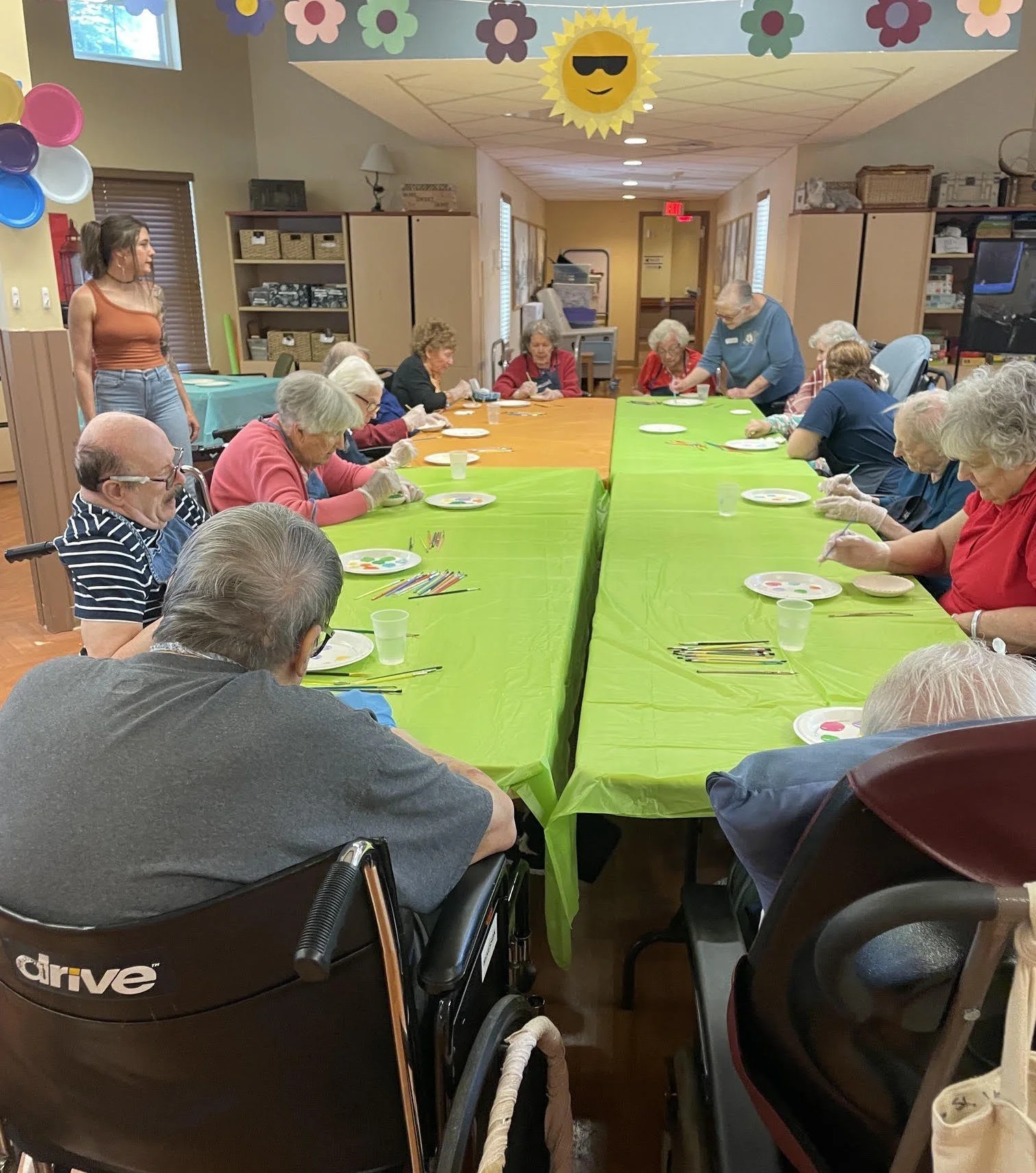The residents all gathered to paint the dishes the Guild made.