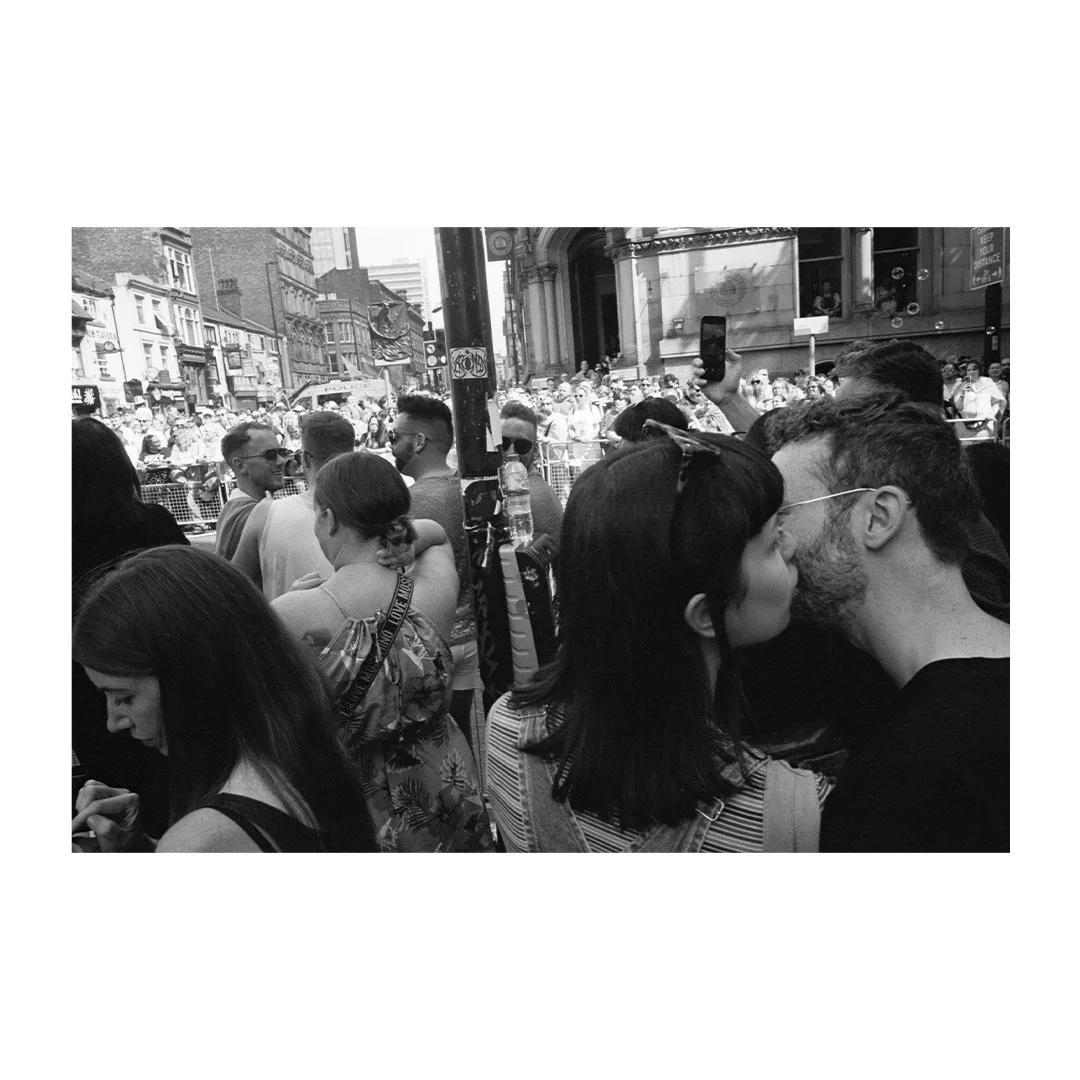 Robert Watson | documentary photography | Manchester Pride | kissing couple in the crowd.jpg