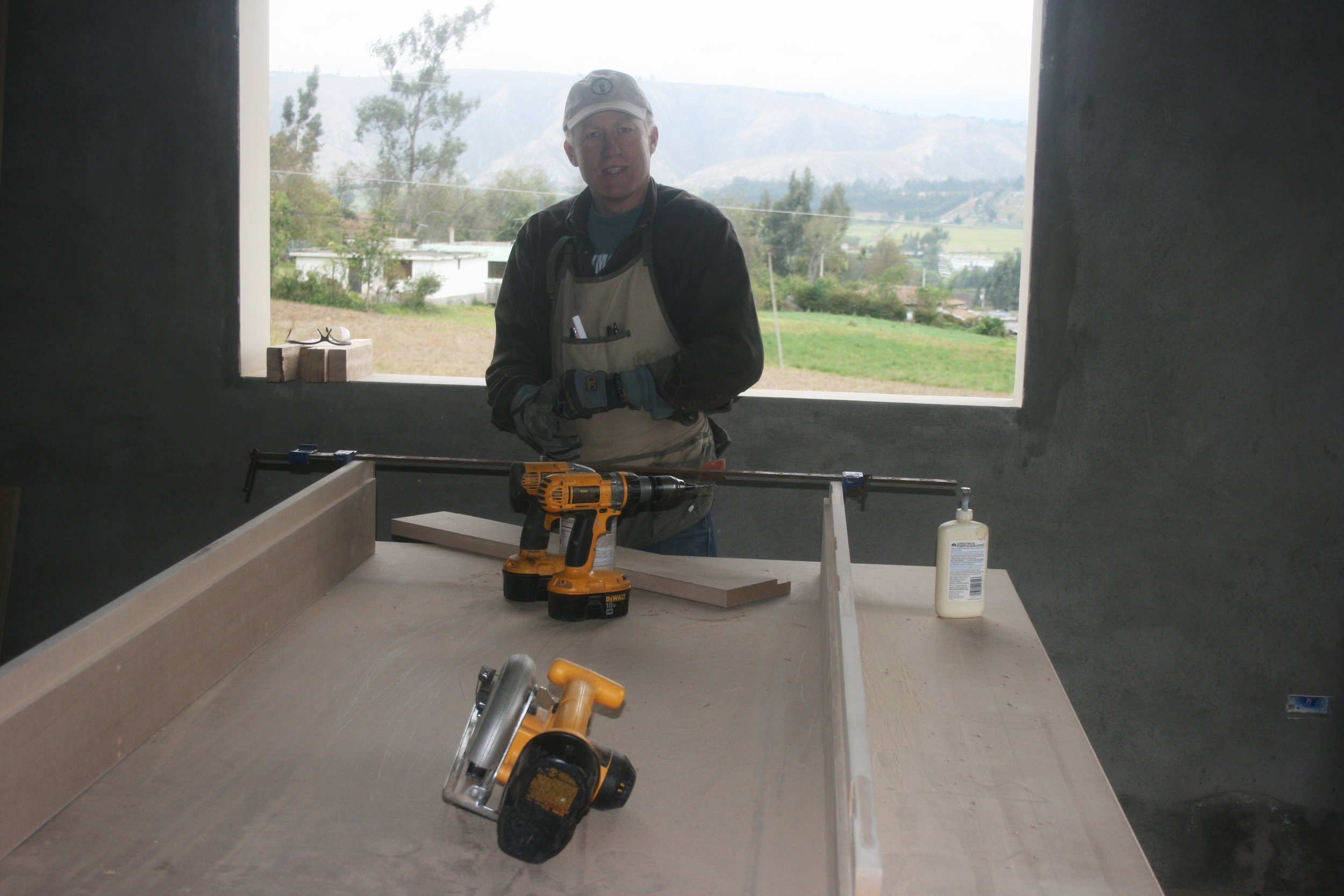 Dean fabricating door jambs for the Latancunga home