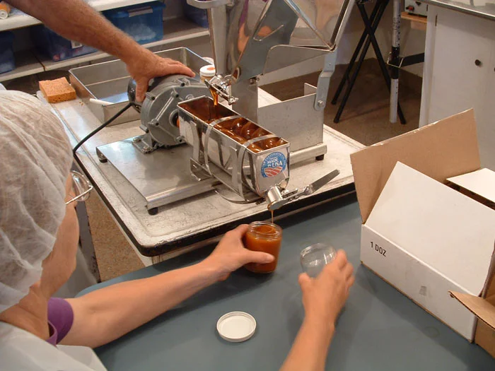 The cooked syrup is cooled to 85 degrees, then stirred slowly in this machine.