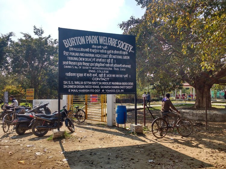 Notice board put by a society on maintaining the status quo of the park at the entrance