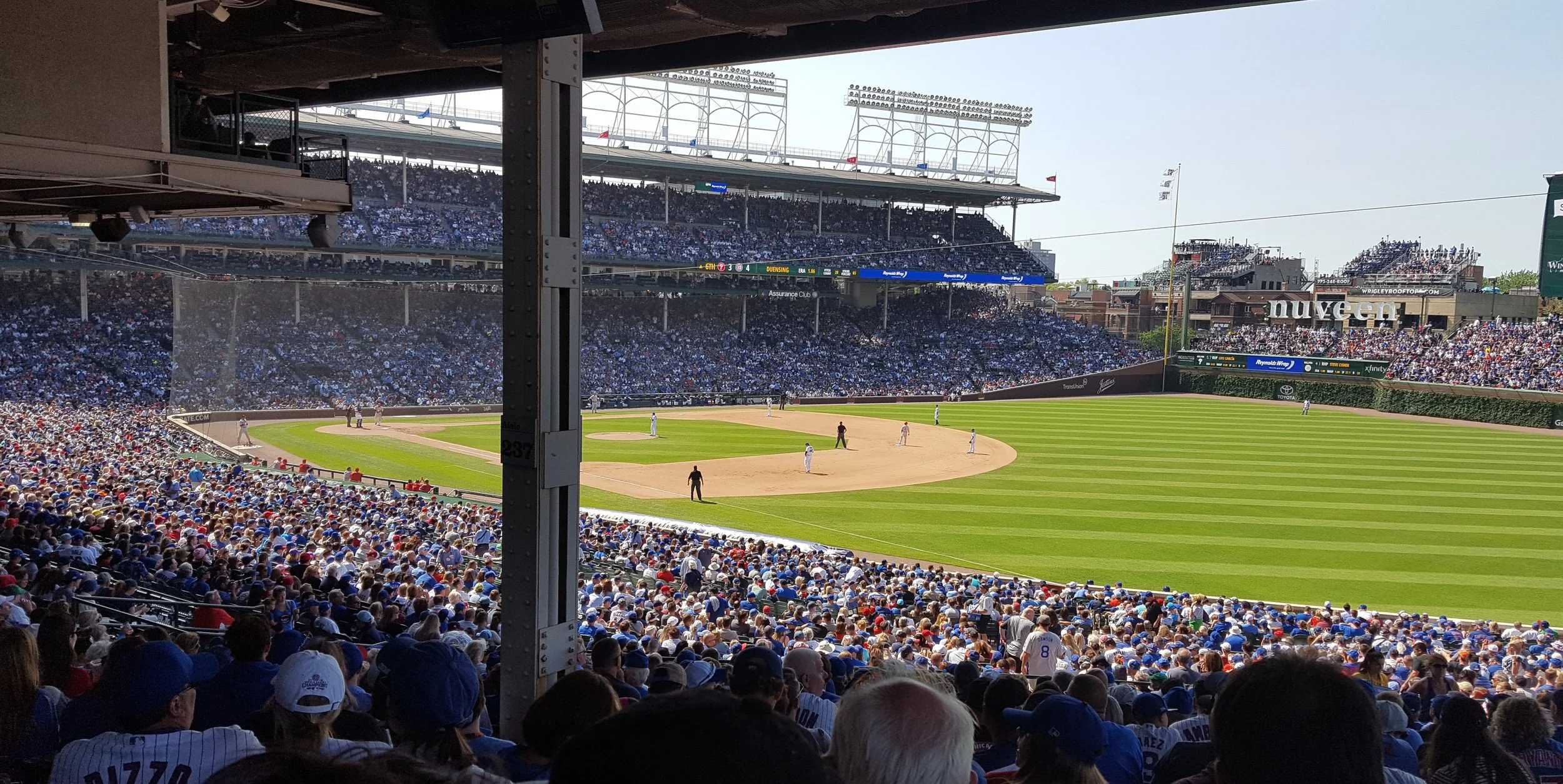 Among the 40,000+ people at Wrigley, we saw a huge variety of experiences. Seated in our section were couples, families, groups of friends, co-workers, and many others. Most had food and/or drinks, many purchasing from the stadium’s mobile vendors.