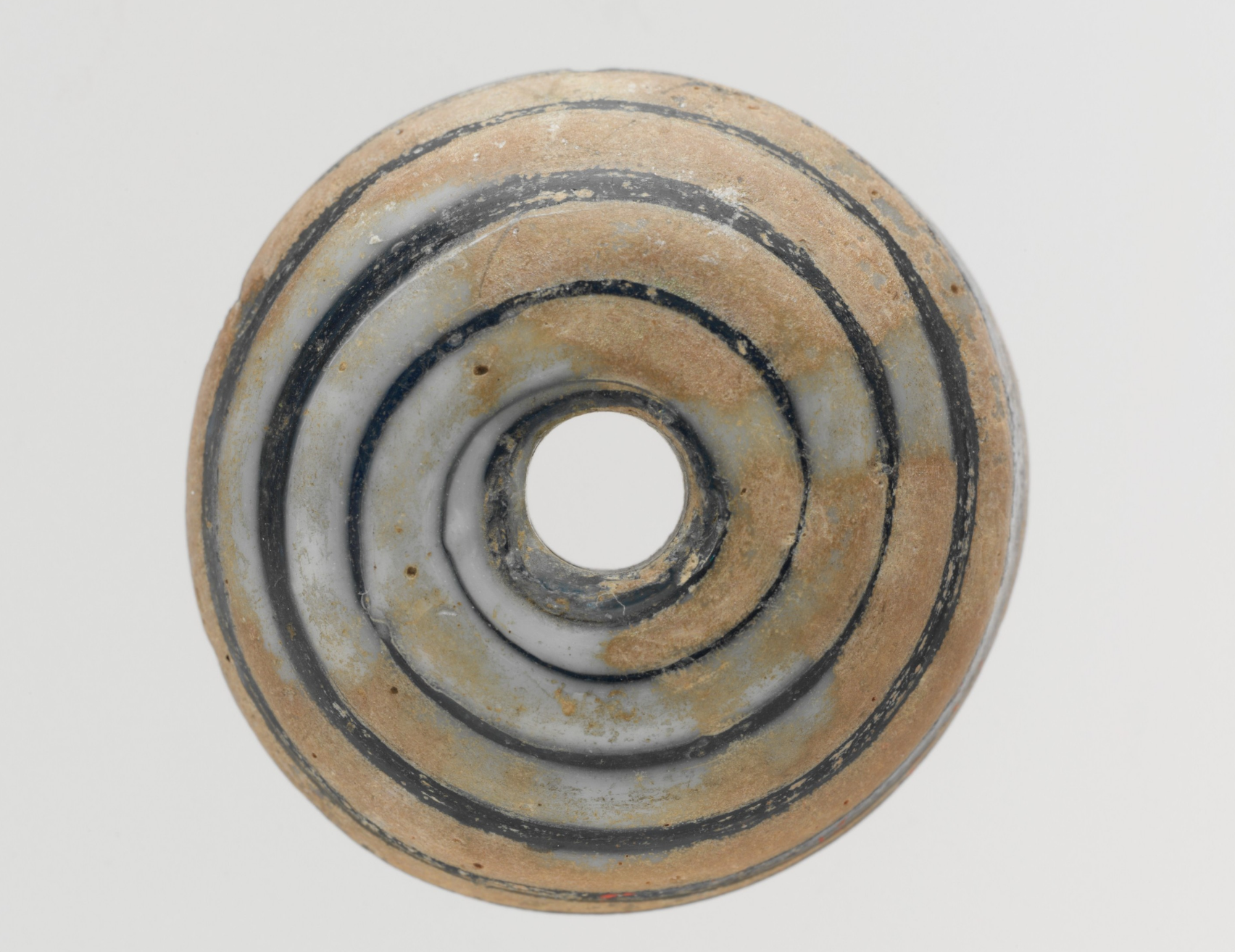 Glass whorl, c0-200 CE, Roman - The Metropolitan Museum of Art https://www.metmuseum.org/art/collection/search/239925