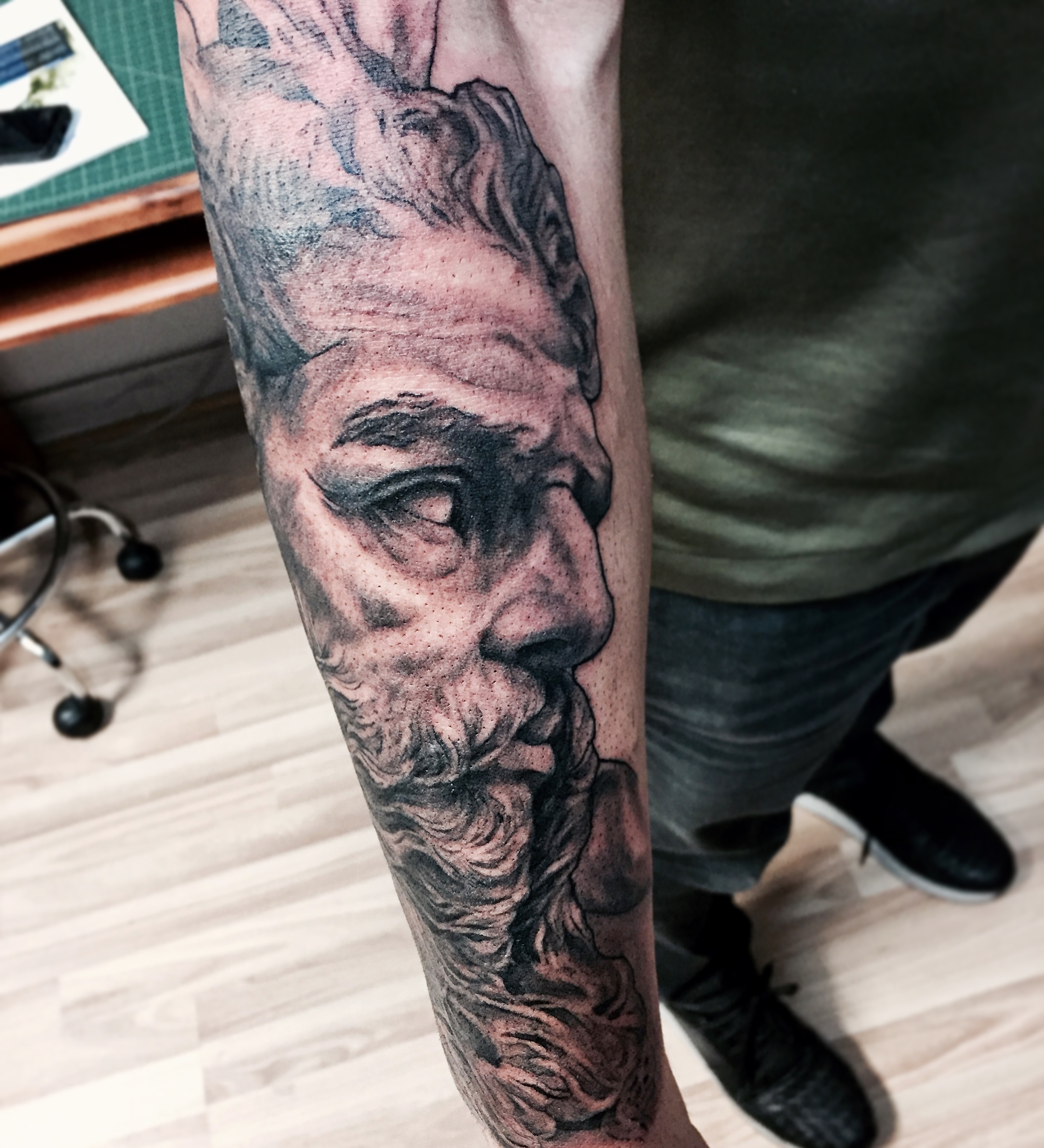 Black And Grey Ink Portrait Tattoo On Sleeve