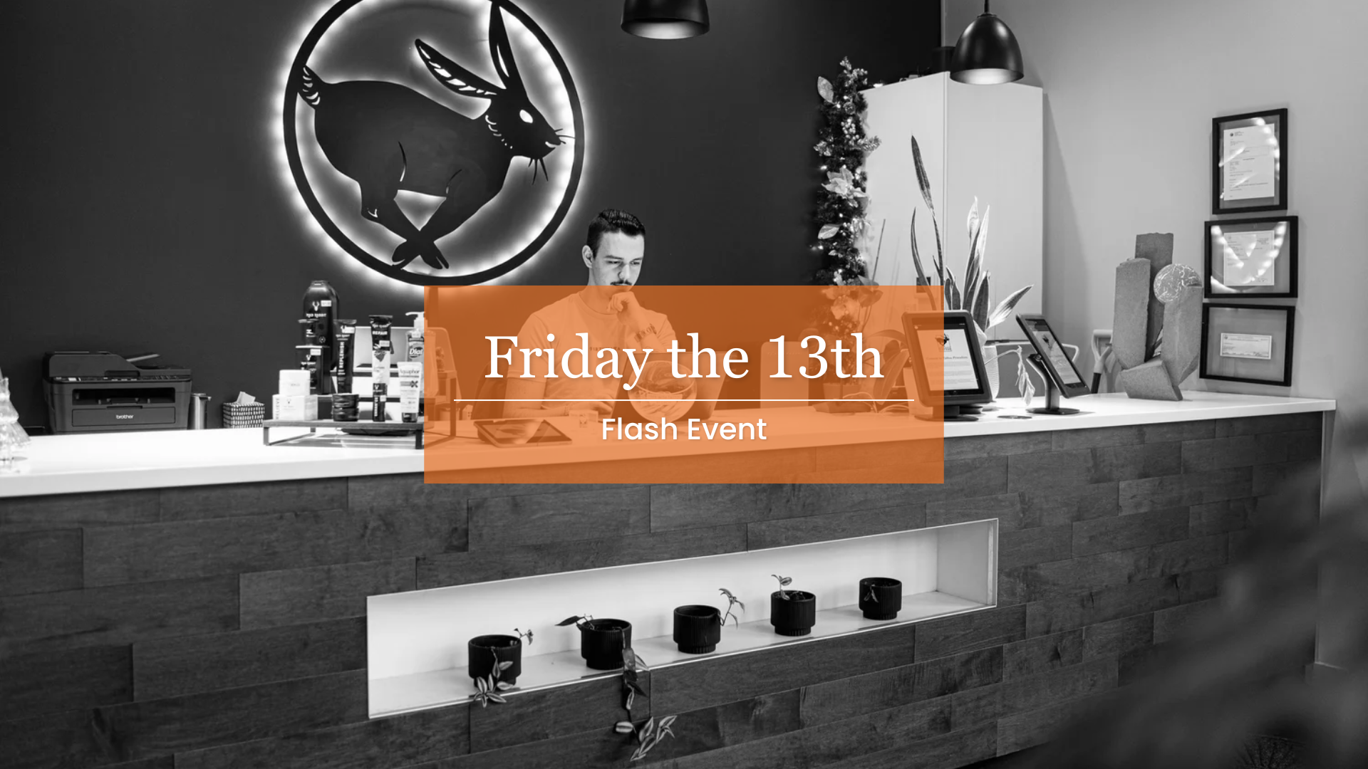 Fortunata Friday the 13th Flash Event. Image Description: A black and white picture of Fortunata's front desk
