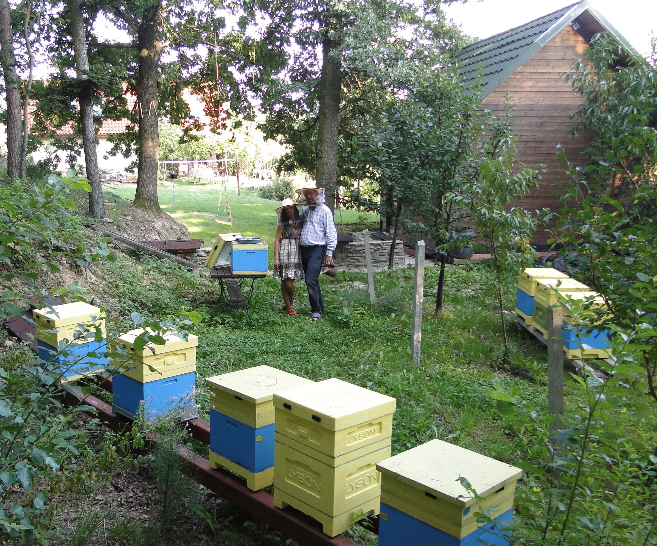 Michal with his wife at their apiary