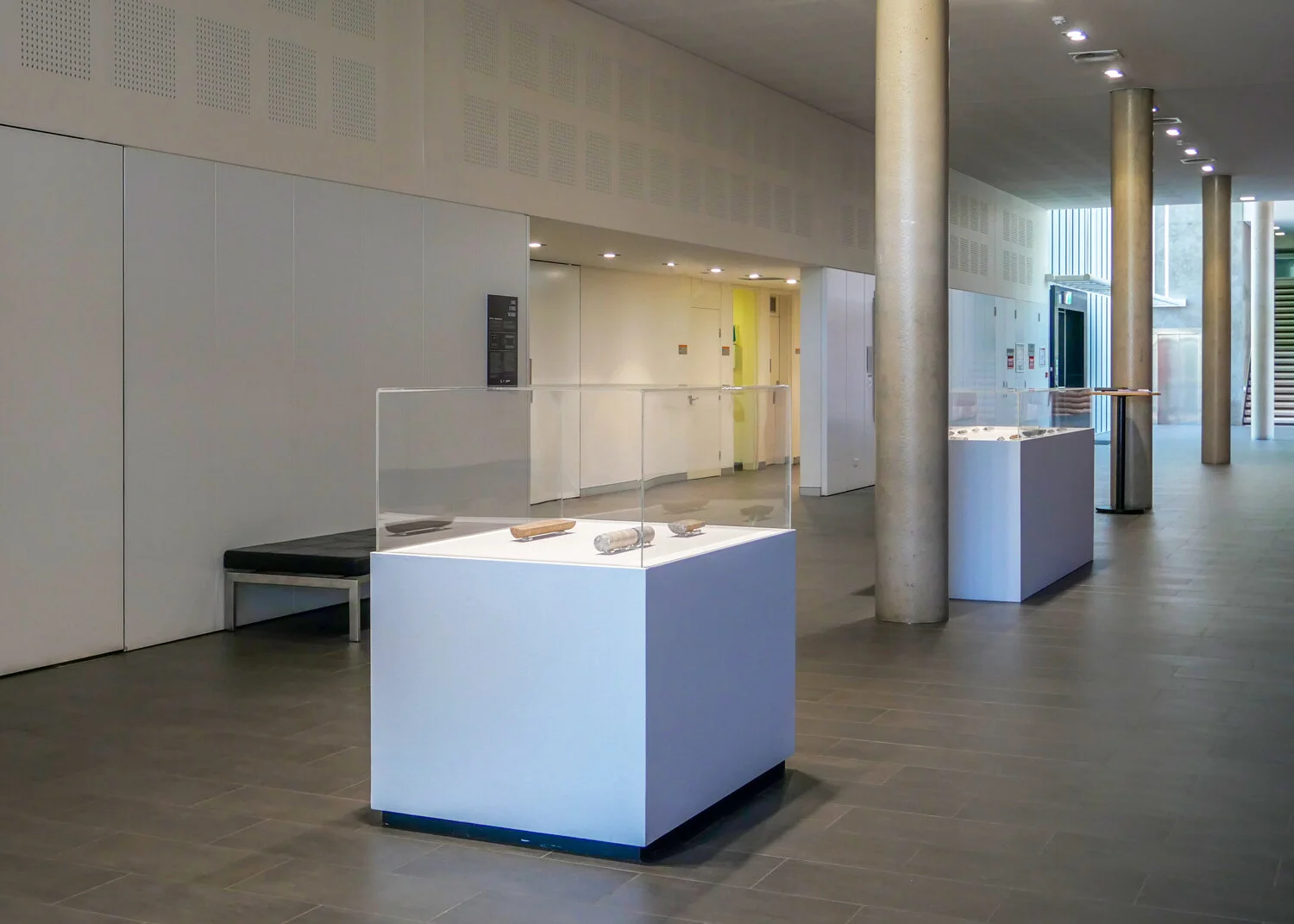 Lee’s ‘ORE CORE SCORE’ exhibition at  Charles Darwin University Art Gallery  in Darwin, comprising 17 core sculptures that are engraved with words to reflect the diverse meanings of the rocks. Image:  Lee Harrop .
