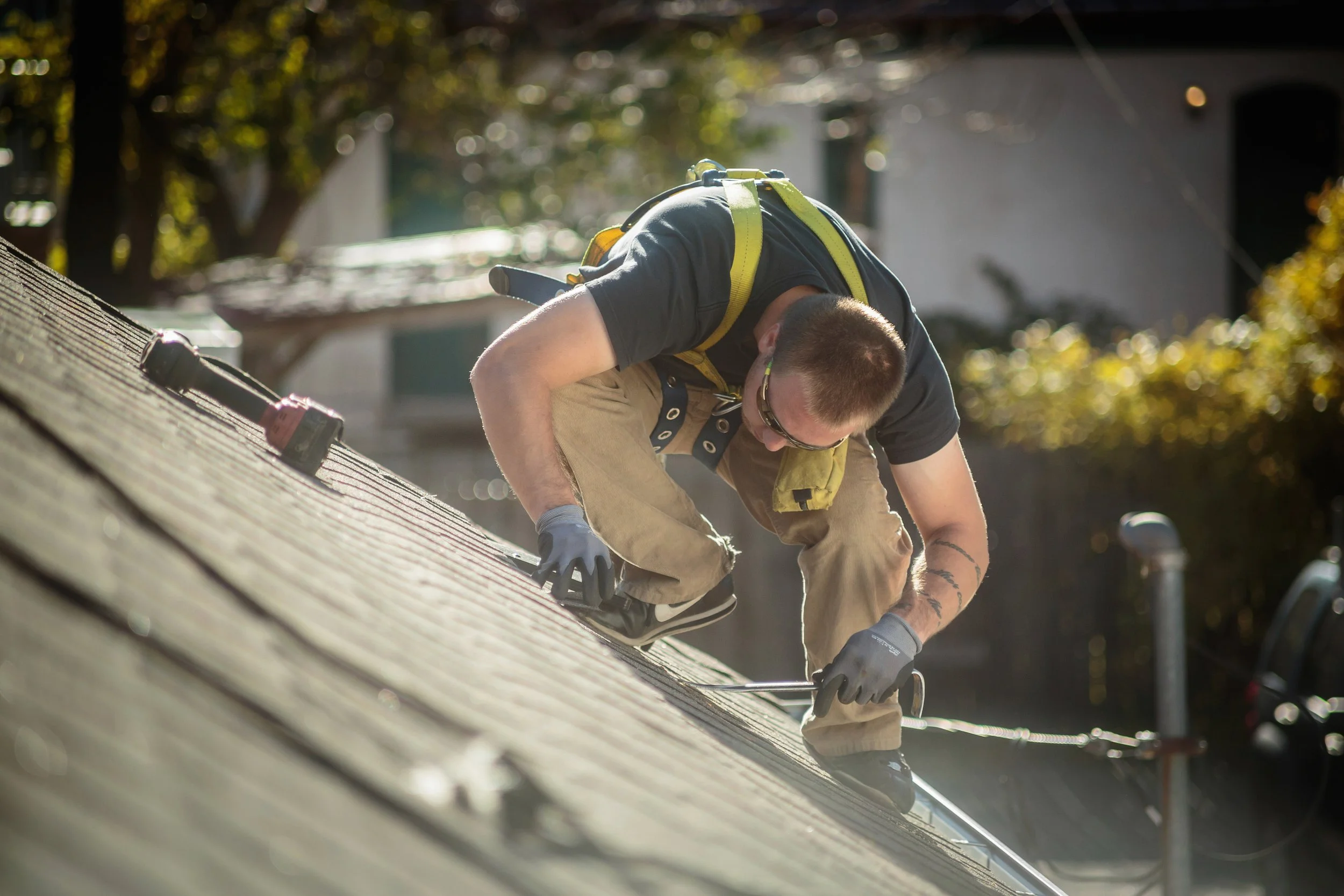 solar-panel-installation-worker-working-on-roof-of-2025-04-04-02-01-09-utc.jpg