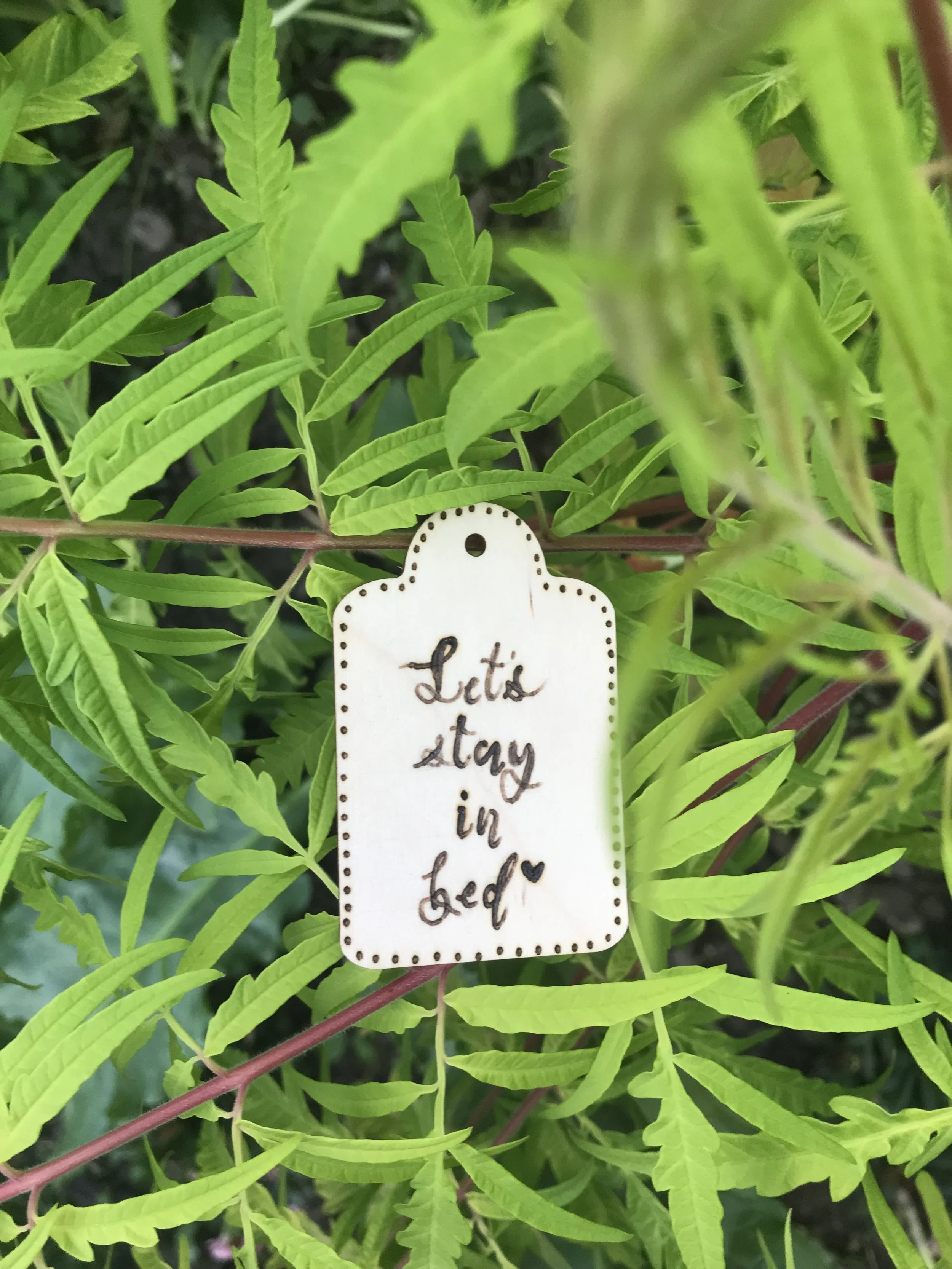 keychain: let's stay in bed •