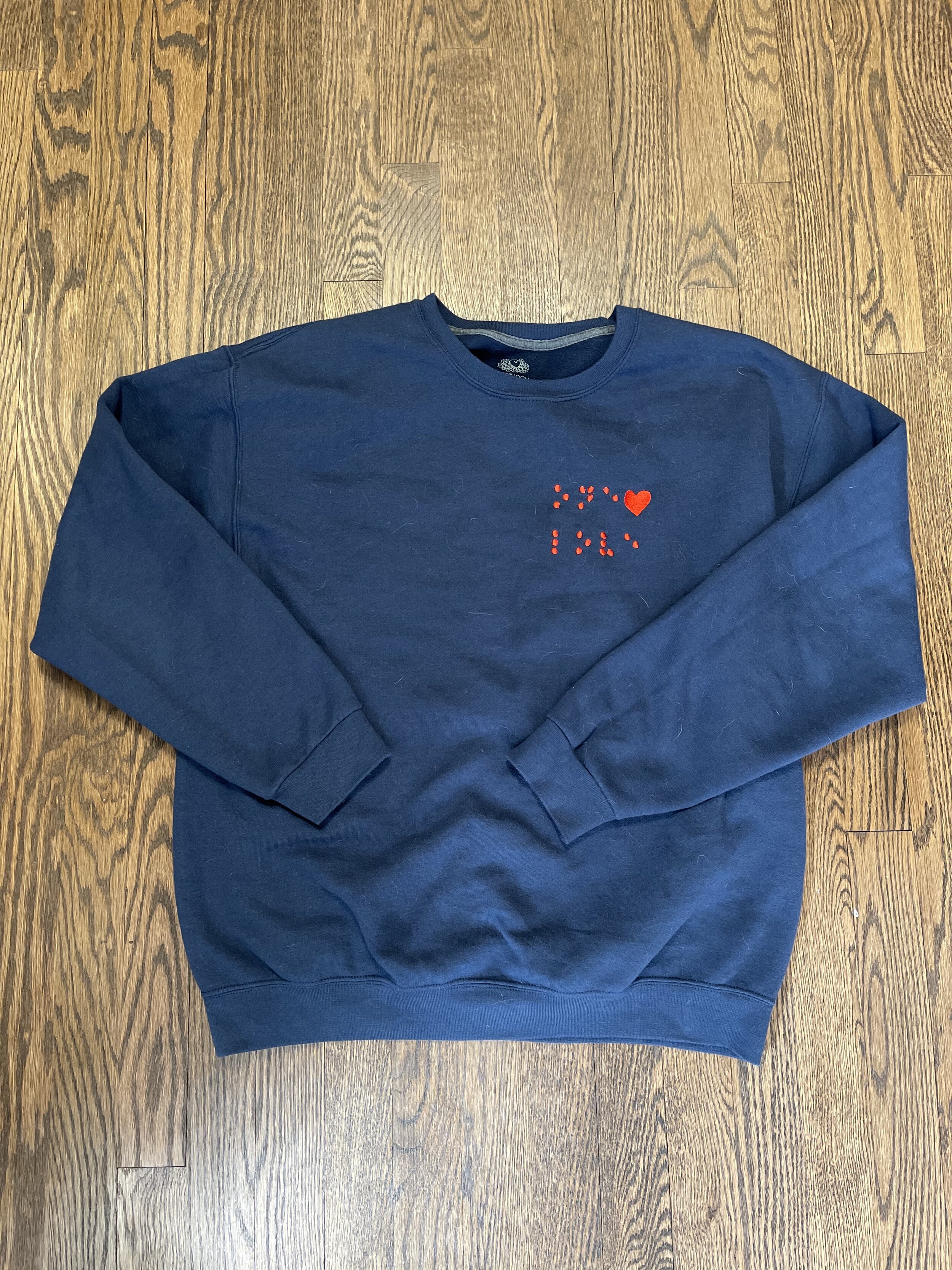 Donations made to the American Foundation for the Blind FEEL THE LOVE Embroidered Braille Unisex Sweatshirt