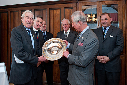HRH The Prince of Wales receives the Royal Smithfield Club Bicentenary Trophy from John Coultrip (Immediate Past President of The Royal Smithfield Club) Behind – Left to Right: John Campbell (Past Club Chairman), Julian Hopwood (Club Chairman Elect), Rees Roberts (2011 Trophy winner) and Angus Stovold (Club Chairman)