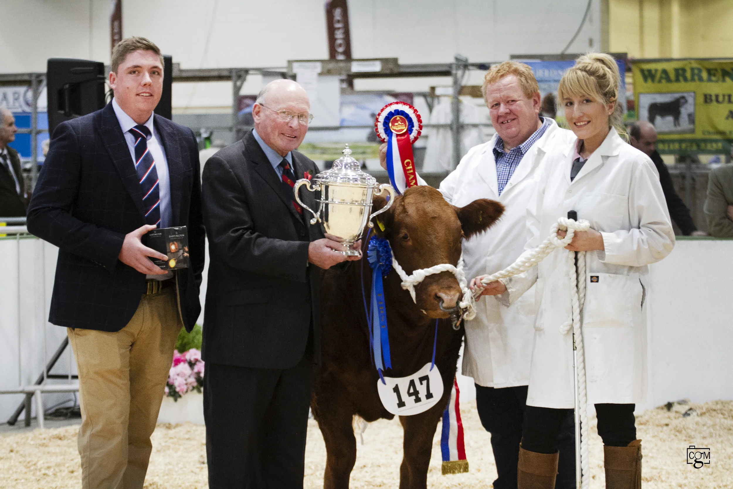 Robert Sloman, Hon Treasurer Royal Cornwall Agricultural Association, presents the Smithfield trophy to Cattle Champions Messrs Morgan & Jones