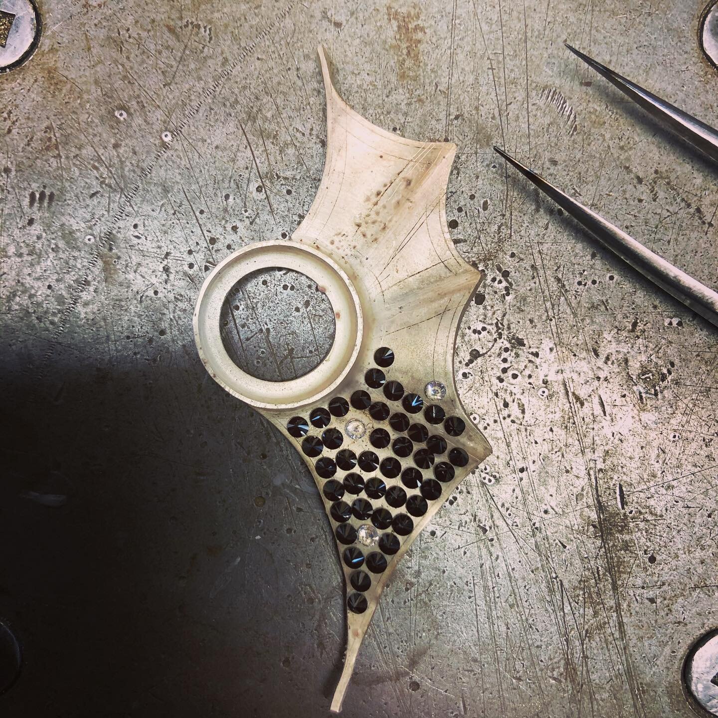 Pav&eacute; bat wing in progress... planning out stone placement. Good thing I love a good puzzle. #jewelry #jewellery #stonesetting #metalsmithsociety #metalsmithing #handmadejewelry #sisterhoodofmetalsmiths #etsymetal #etsymetalteam #pave