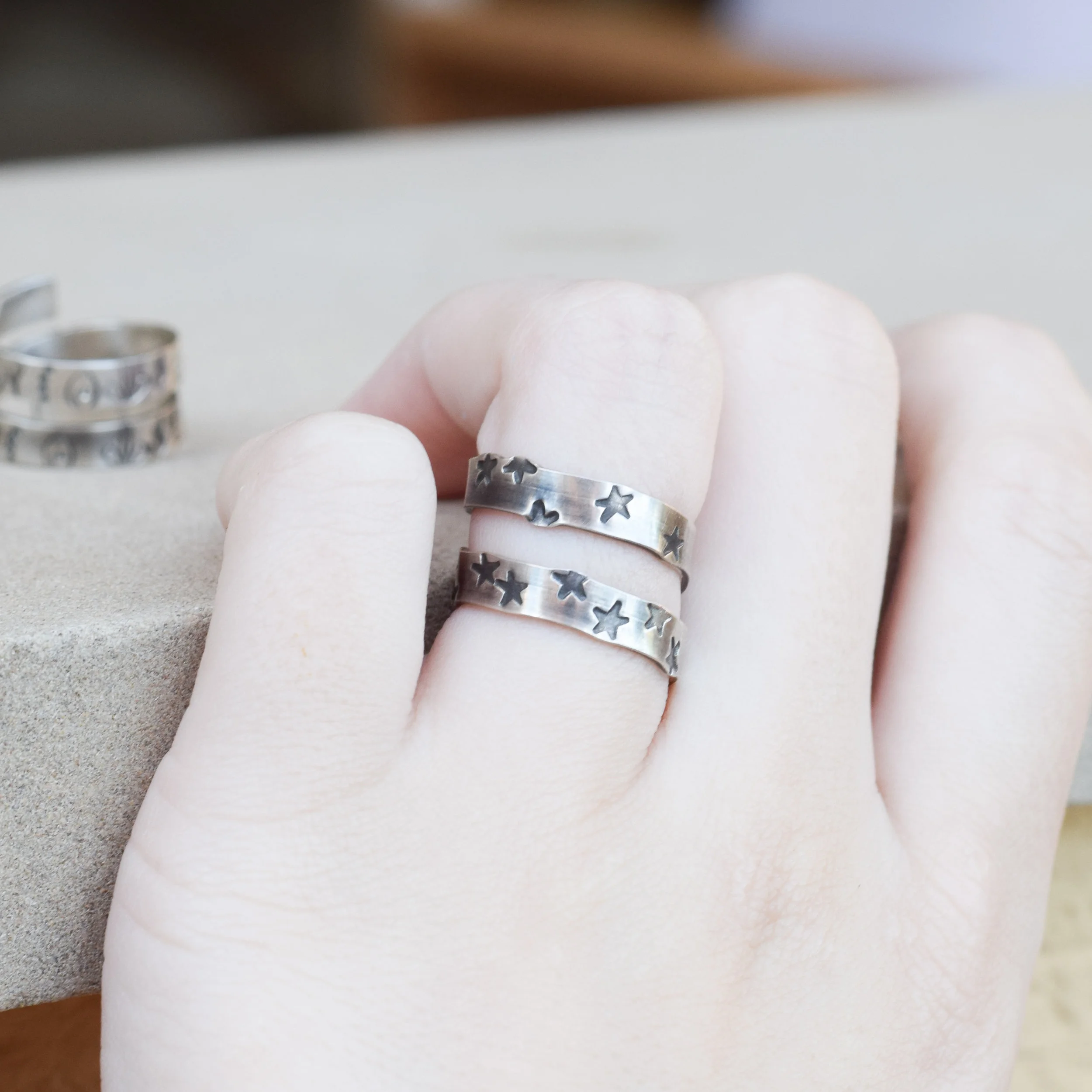 Open ended wrap around ring with a hand stamped pattern