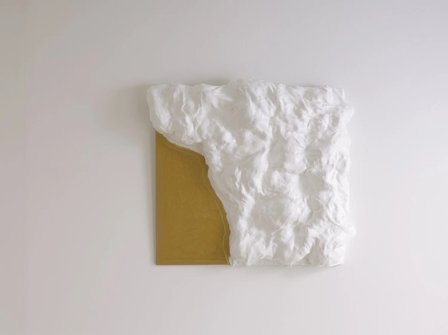 A sculptural wall artwork handcrafted from recycled plastic, combining tactile texture with refined design.