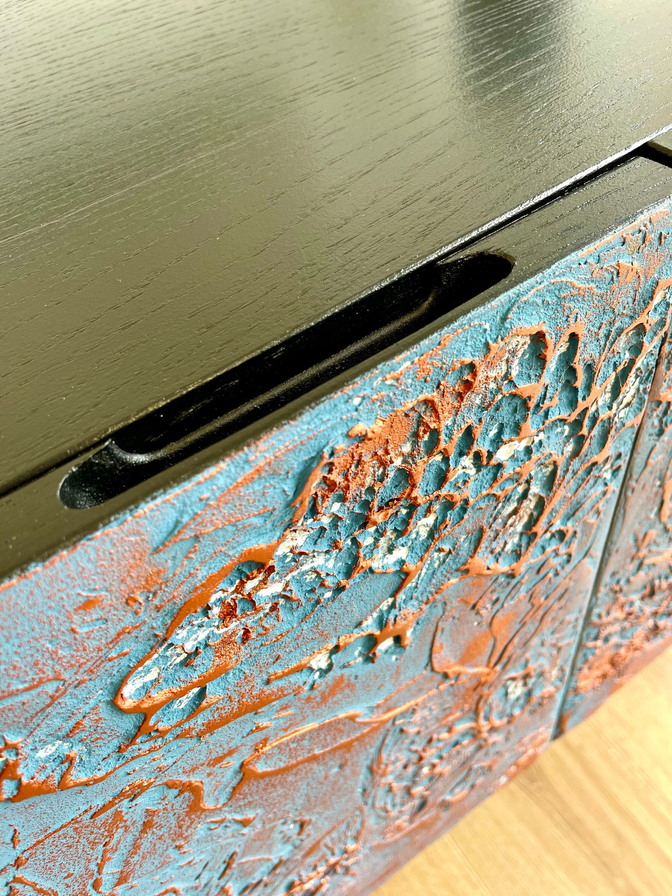 Routed handle on top edge of the textured doors.