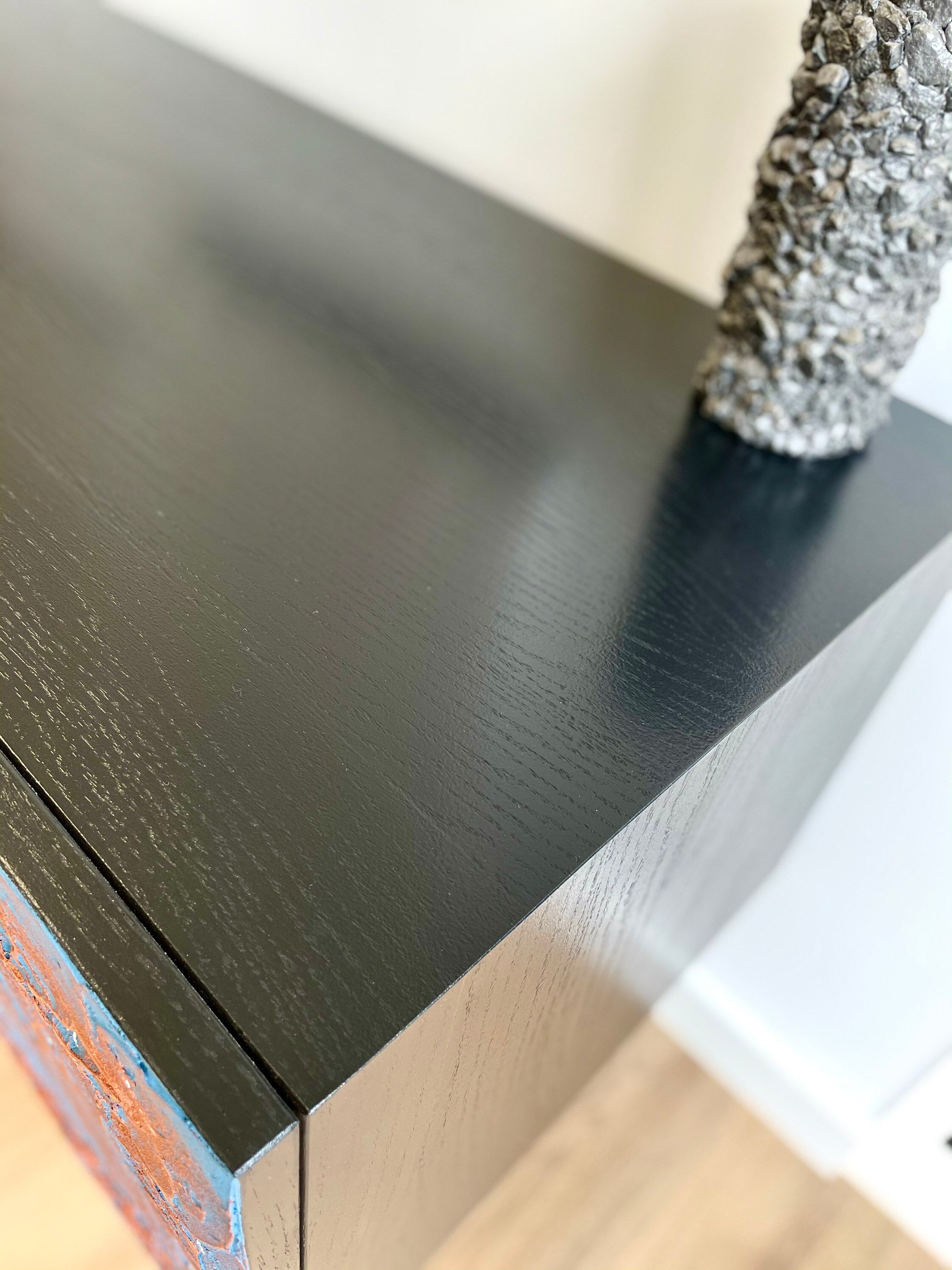 Top of the sideboard painted in black.