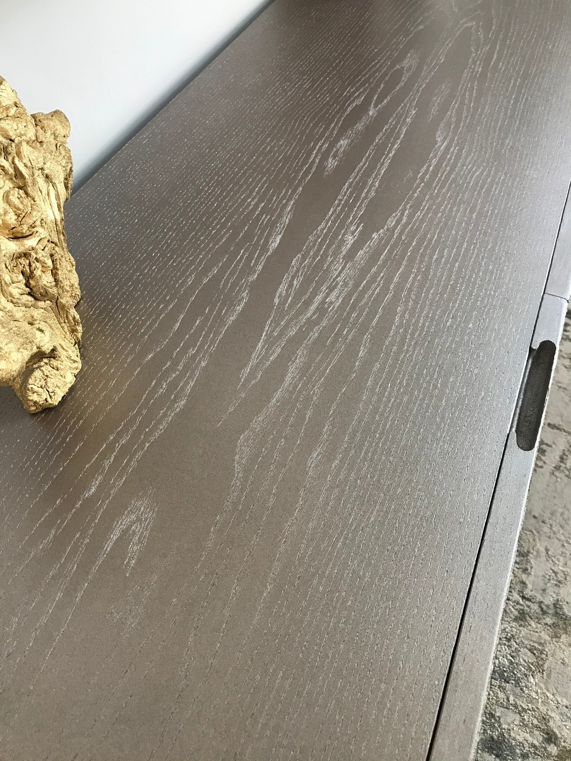 Display of shimmering top with close up on routed handle.