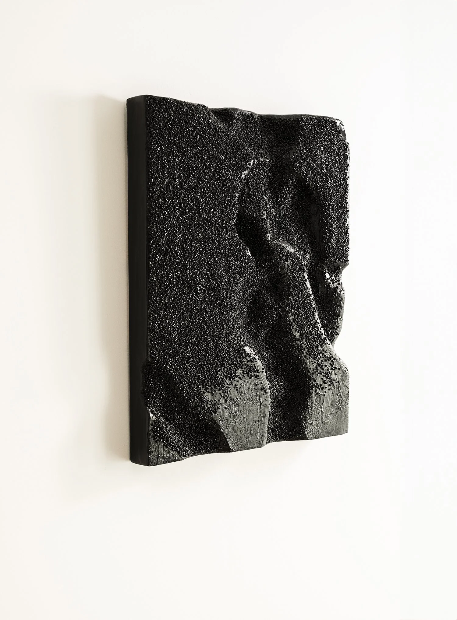 Bold, dark minimalist 3D sculpture, "Obsidian Tide," with deep textural relief.