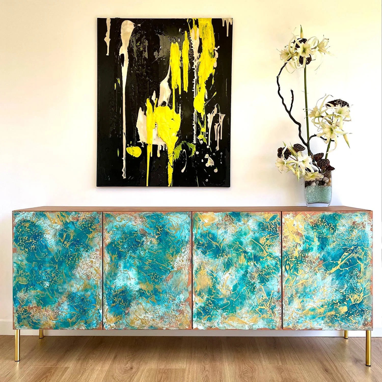 Textured sideboard with sea blue green colours and a touch of gold.