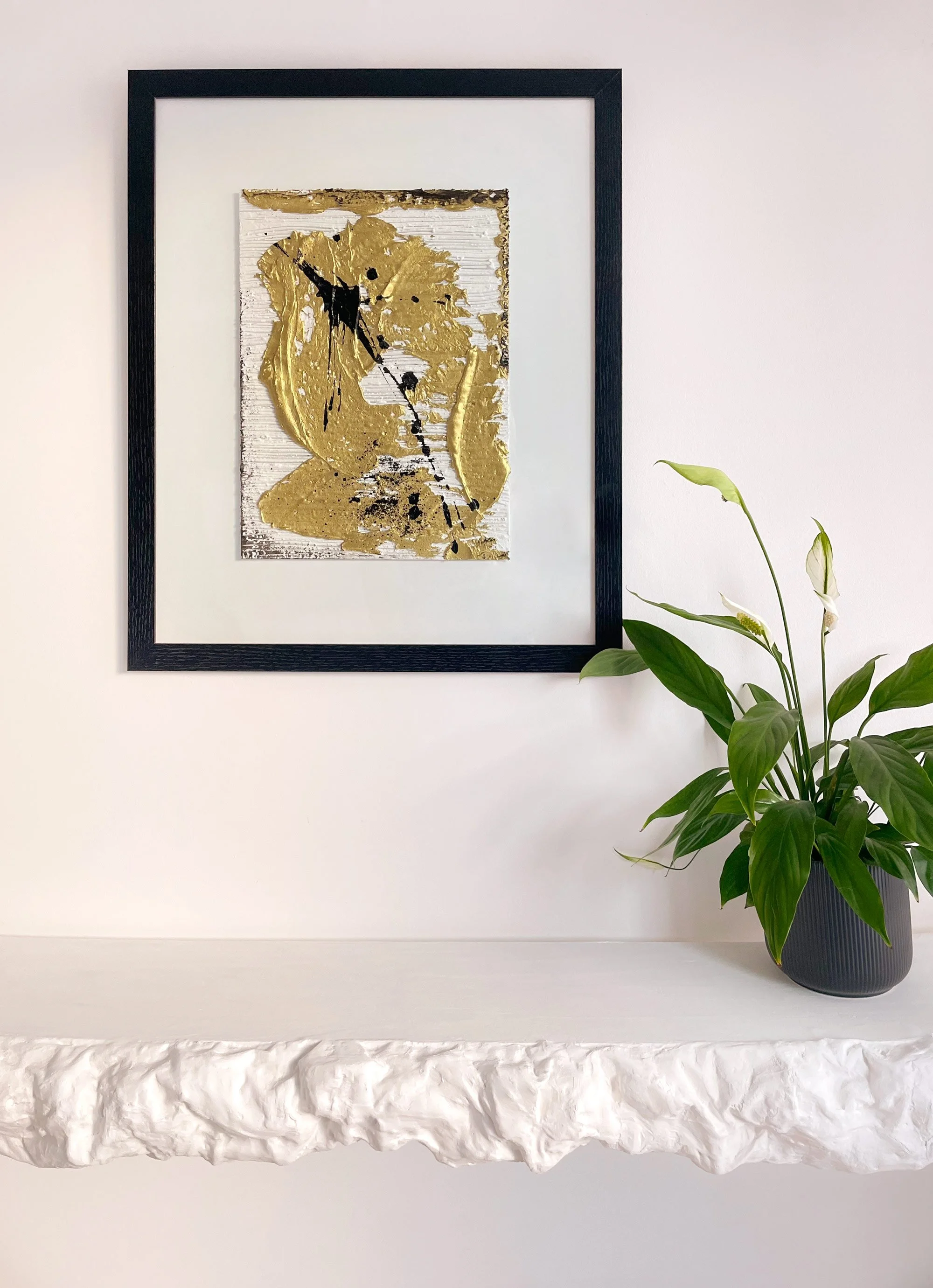 Original textured abstract art with gold and black splashes.