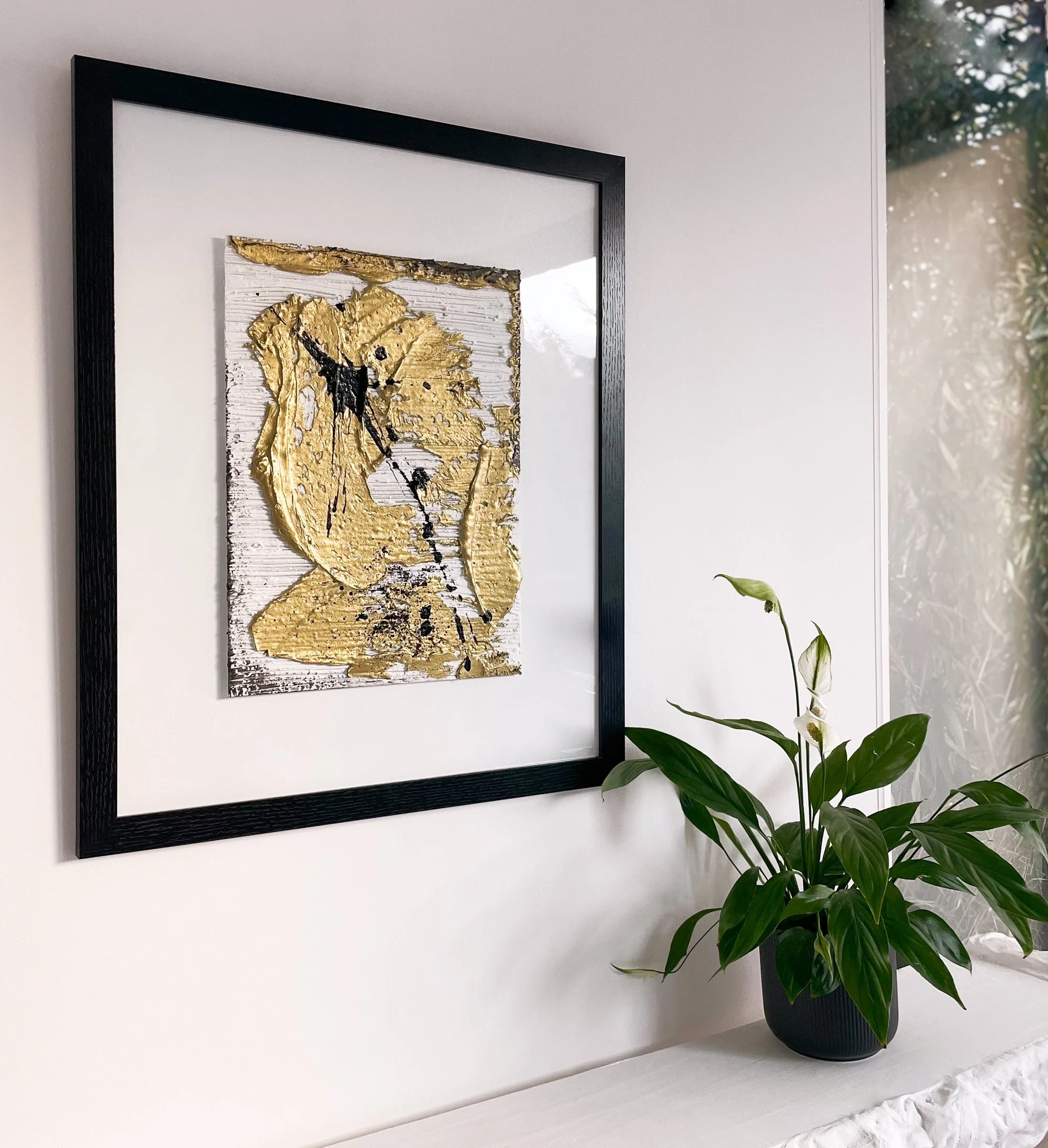 One-of-a-kind gold and black abstract painting.