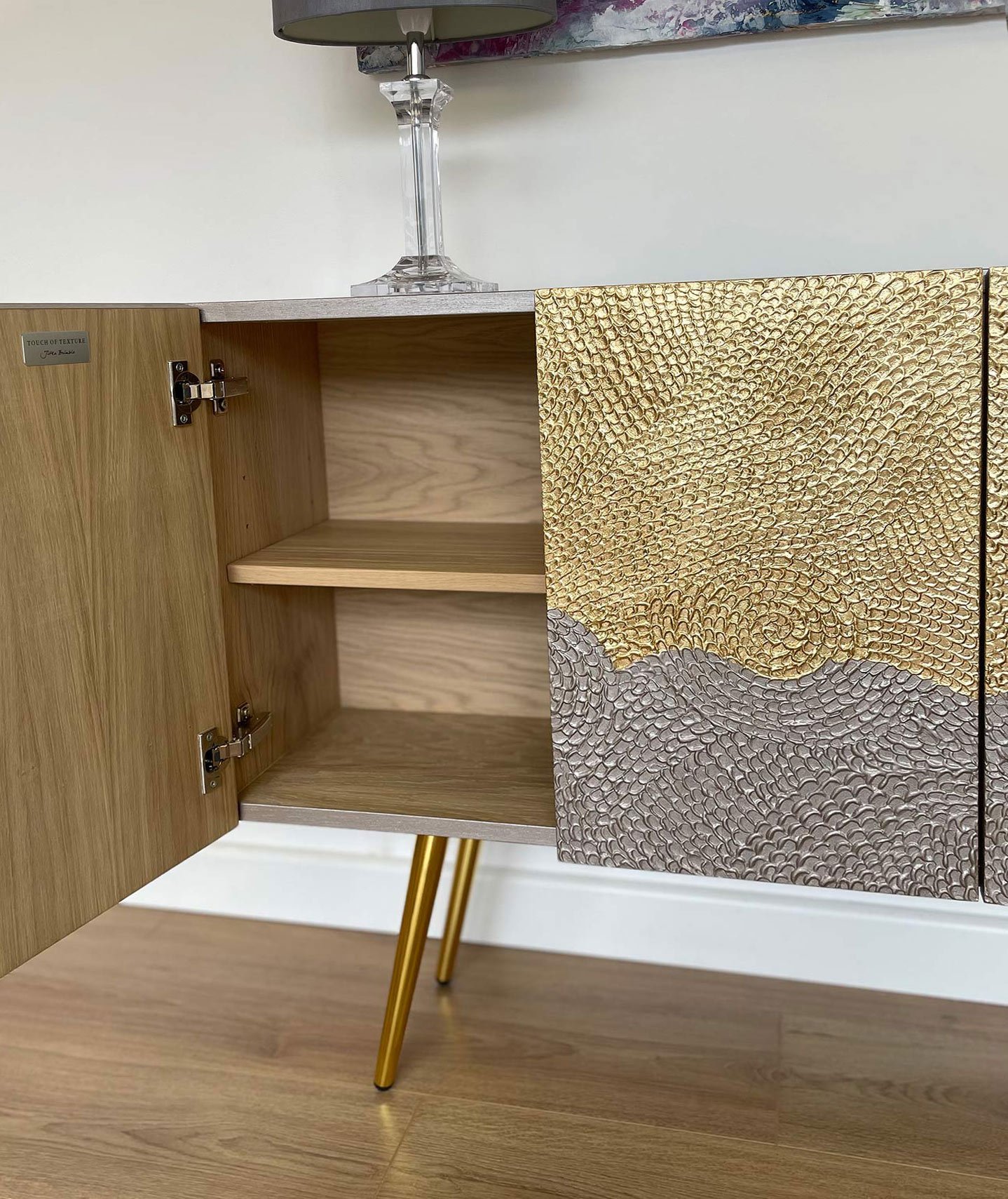 Interior of the bespoke 4-door gold sideboard showing premium oak veneer construction, soft-close hinges, and adjustable shelving.