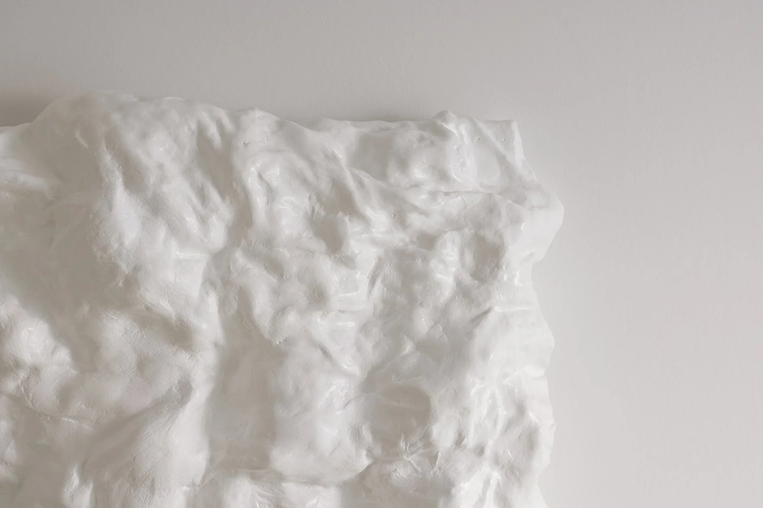 Close up on distinctive white art  piece that adds depth and sophistication to your space.