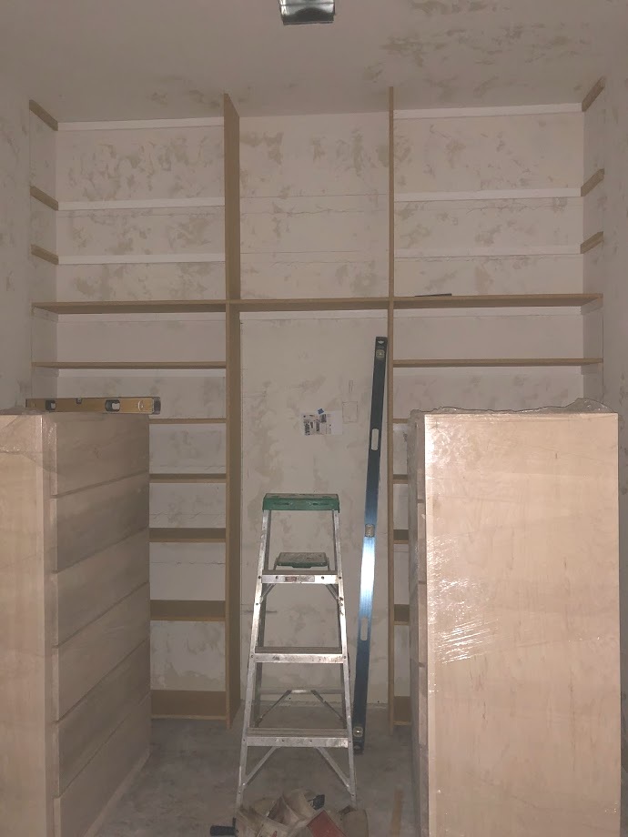 Master closet shoe and dresser area