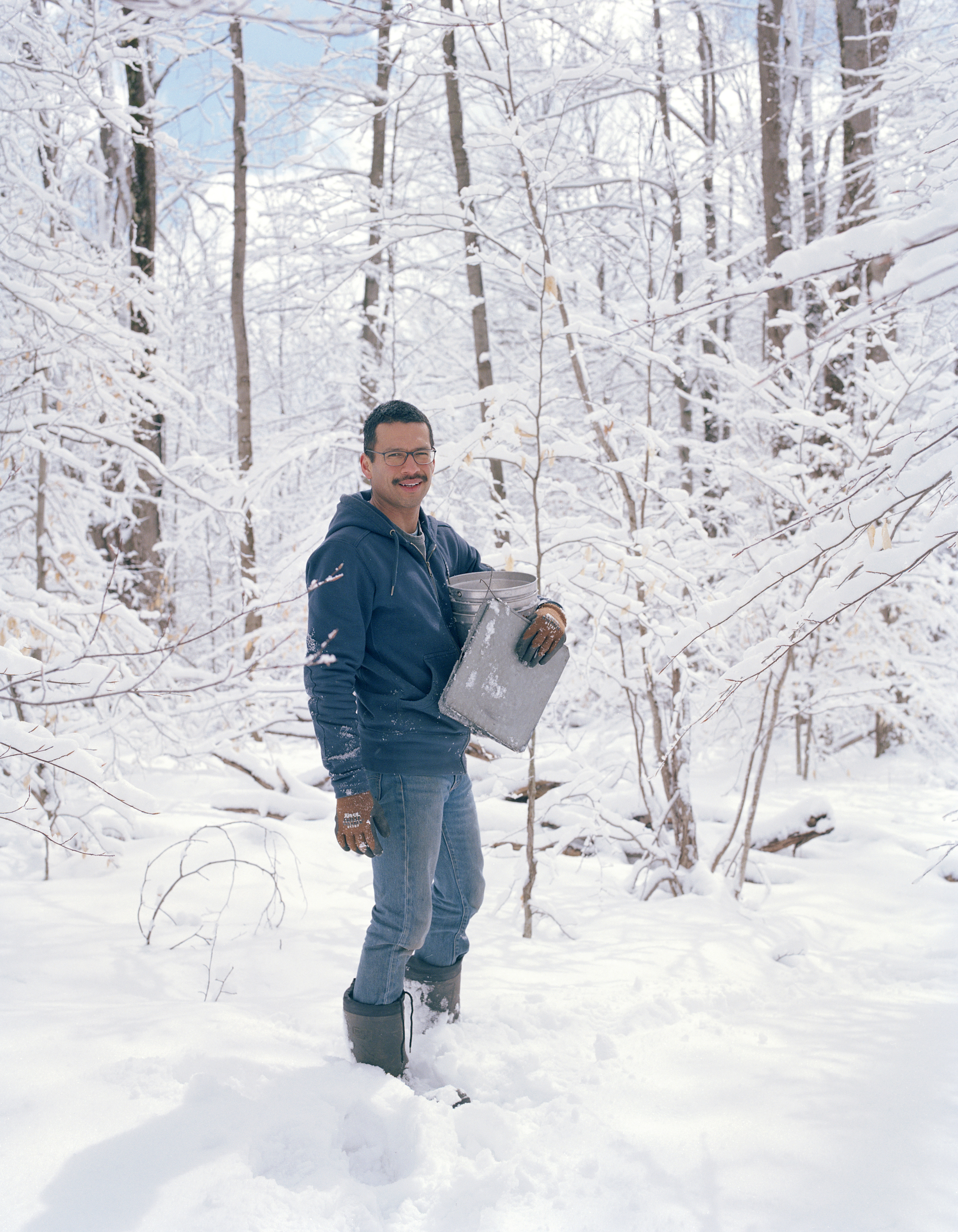 Simon collecting sap buckets in January 2018, a few weeks before him and Robert moved to Detroit. They moved to Stamford from New York City.