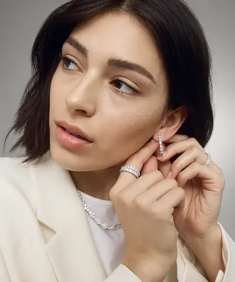 Model_wearing_diamond_jewelry_rings_and_necklaces.webp
