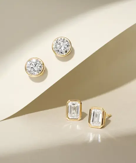 2_pairs_of_bezel_set_diamond_earrings.webp