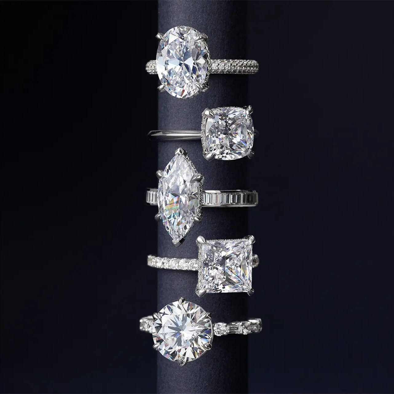 a_collection_of_diamond_rings_stacked_on_display_stand 1.png