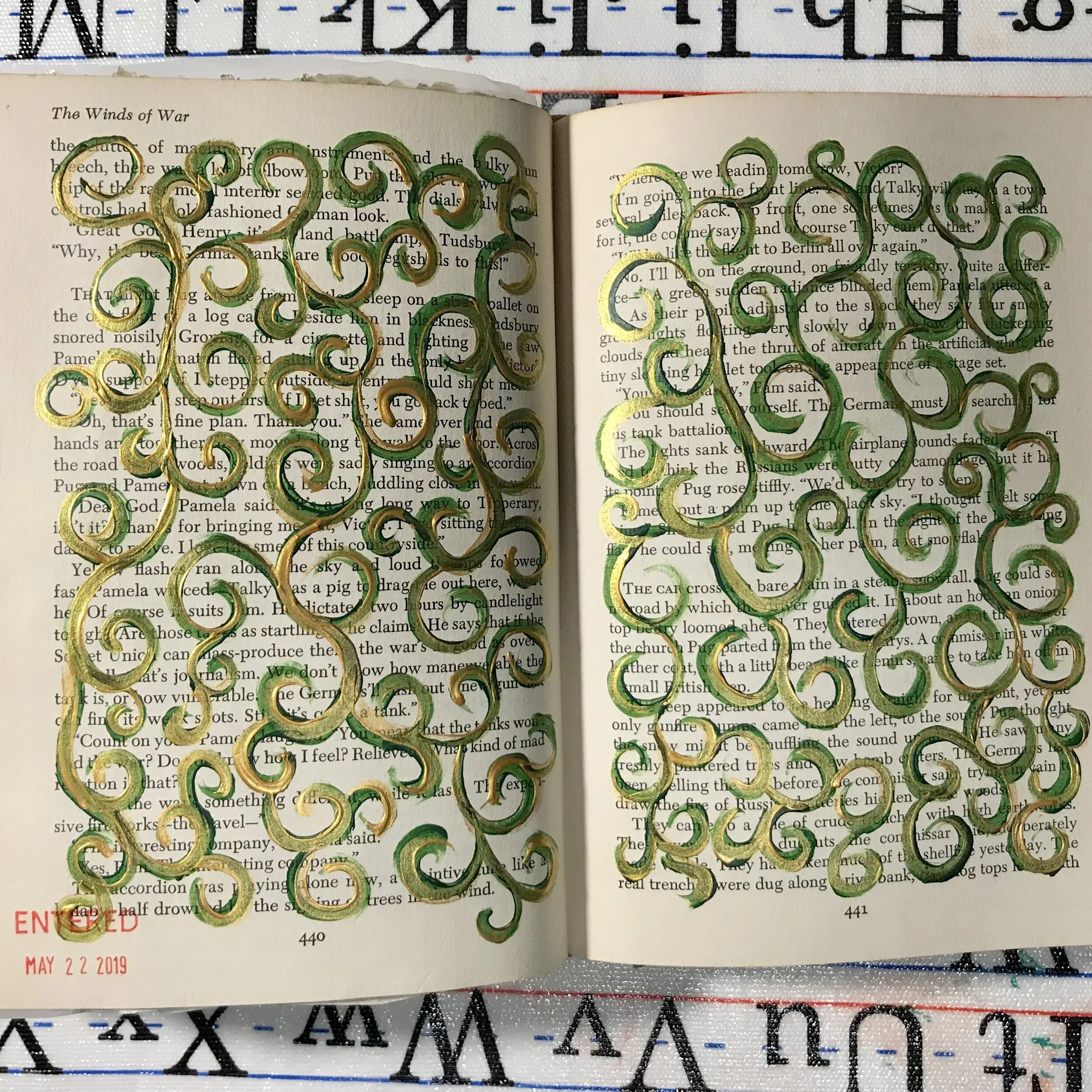 Acrylics. To keep painted pages from sticking together, I cut small pieces of waxed paper and slipped them between the pages.