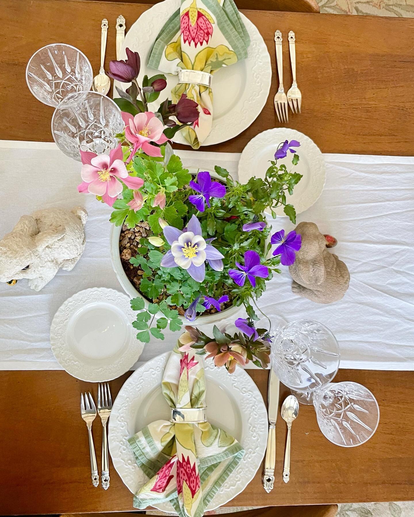 Save! If you are like me &mdash; not quite ready for Easter &mdash; here&rsquo;s a quick and festive table setting idea from last year. Pop over to your local garden center. I filled white pots with colorful blooms: two varieties of Aquilegia (aka Co