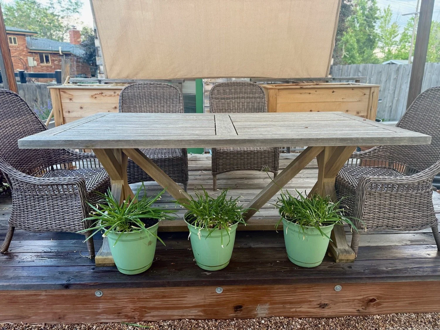 Pots lined up under a table's edge