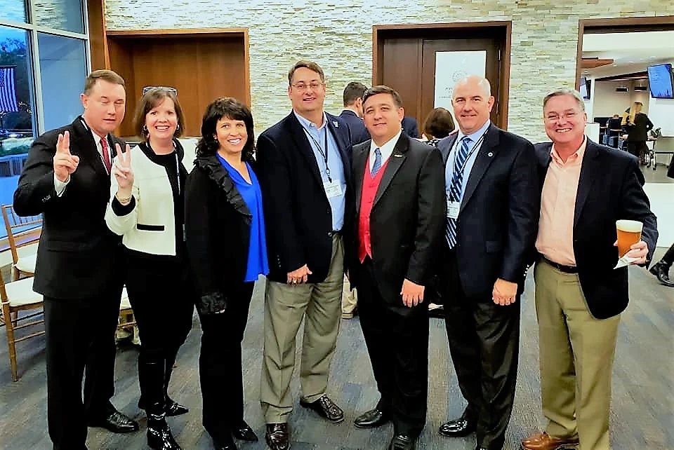 Jerry (middle) mingling with fellow alums.