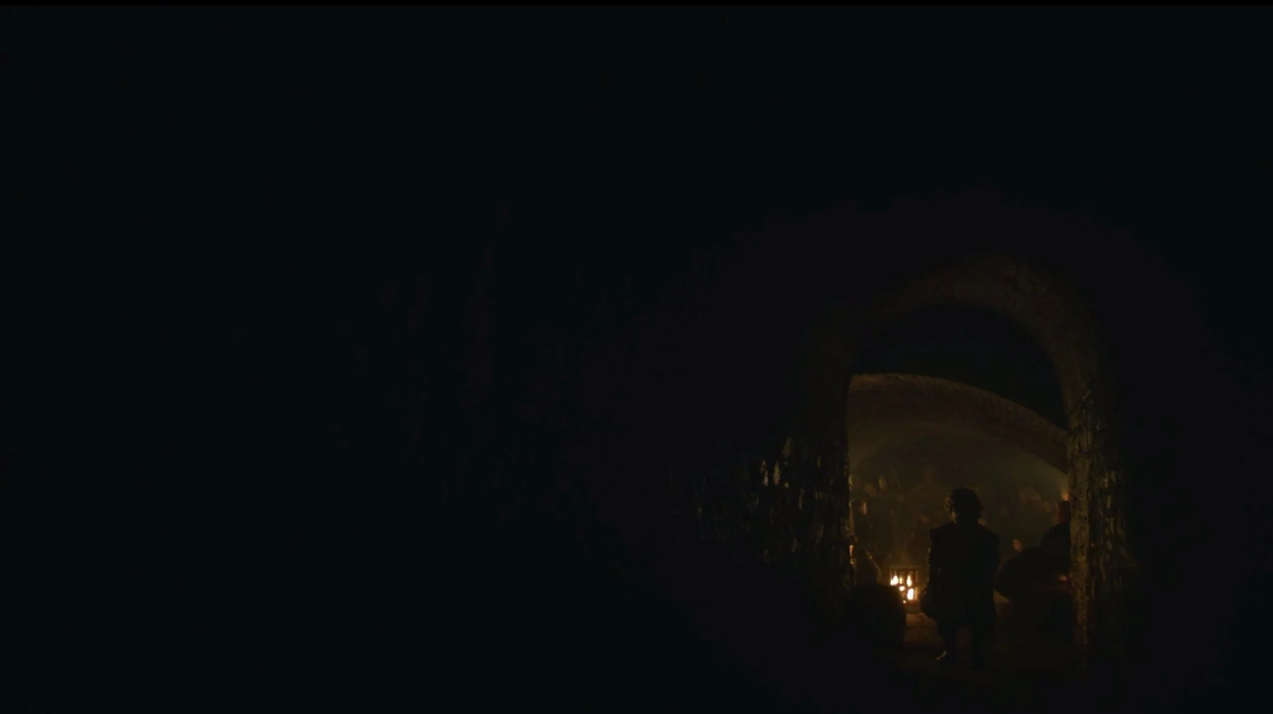 At the beginning of the battle, we see Tyrion’s small, still figure in the bottom right of the screen, silhouetted by firelight and facing pitch darkness. The doorway surrounds him like a mouth, as if he is about to be swallowed by the encompassing …