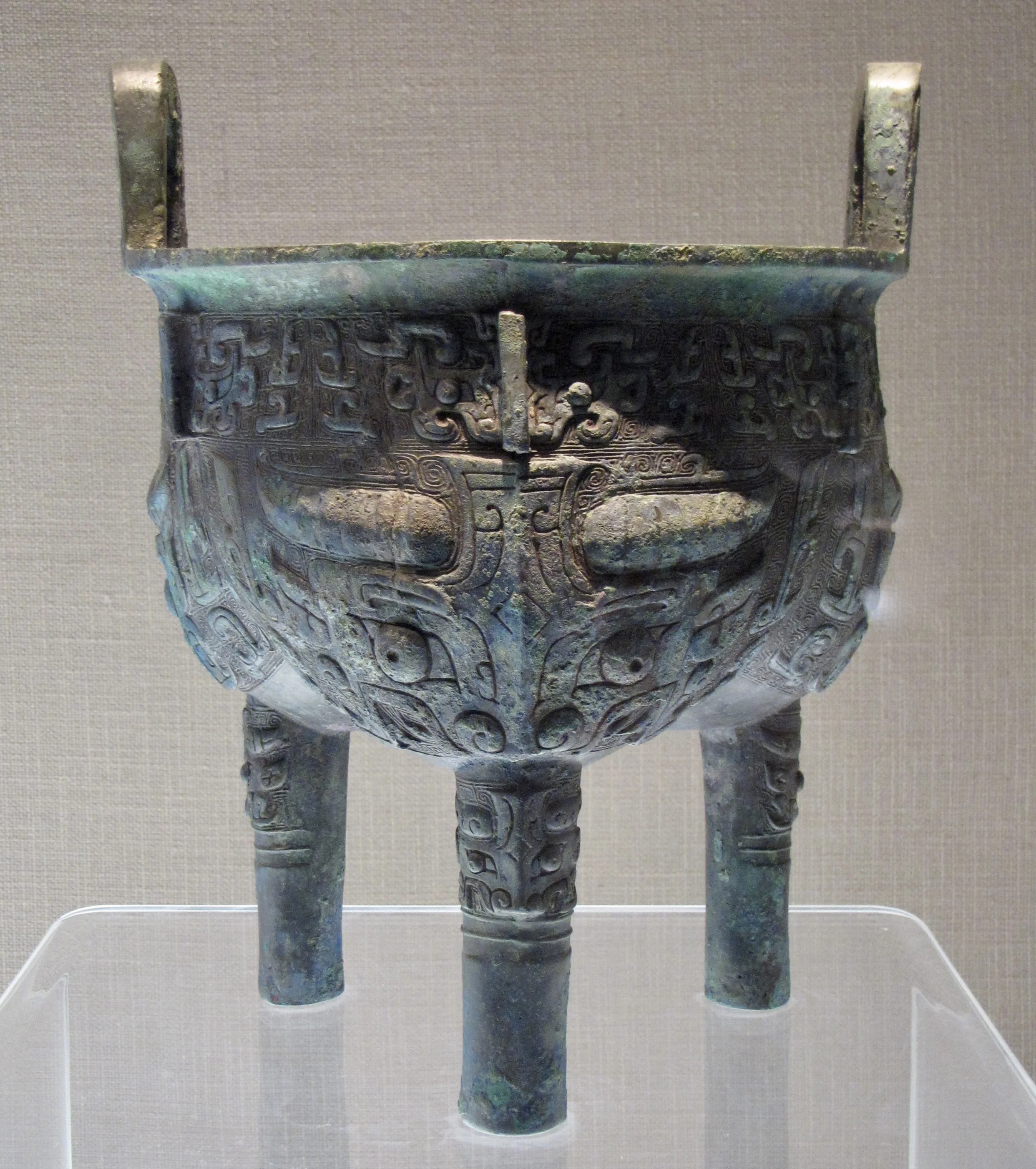 Tripod ding (or li ding) with three bands of taotie designs in the Capital Museum, Beijing. Mid-11th–mid-10th century BCE, Western Zhou period. Photo by Renée DeVoe Mertz.