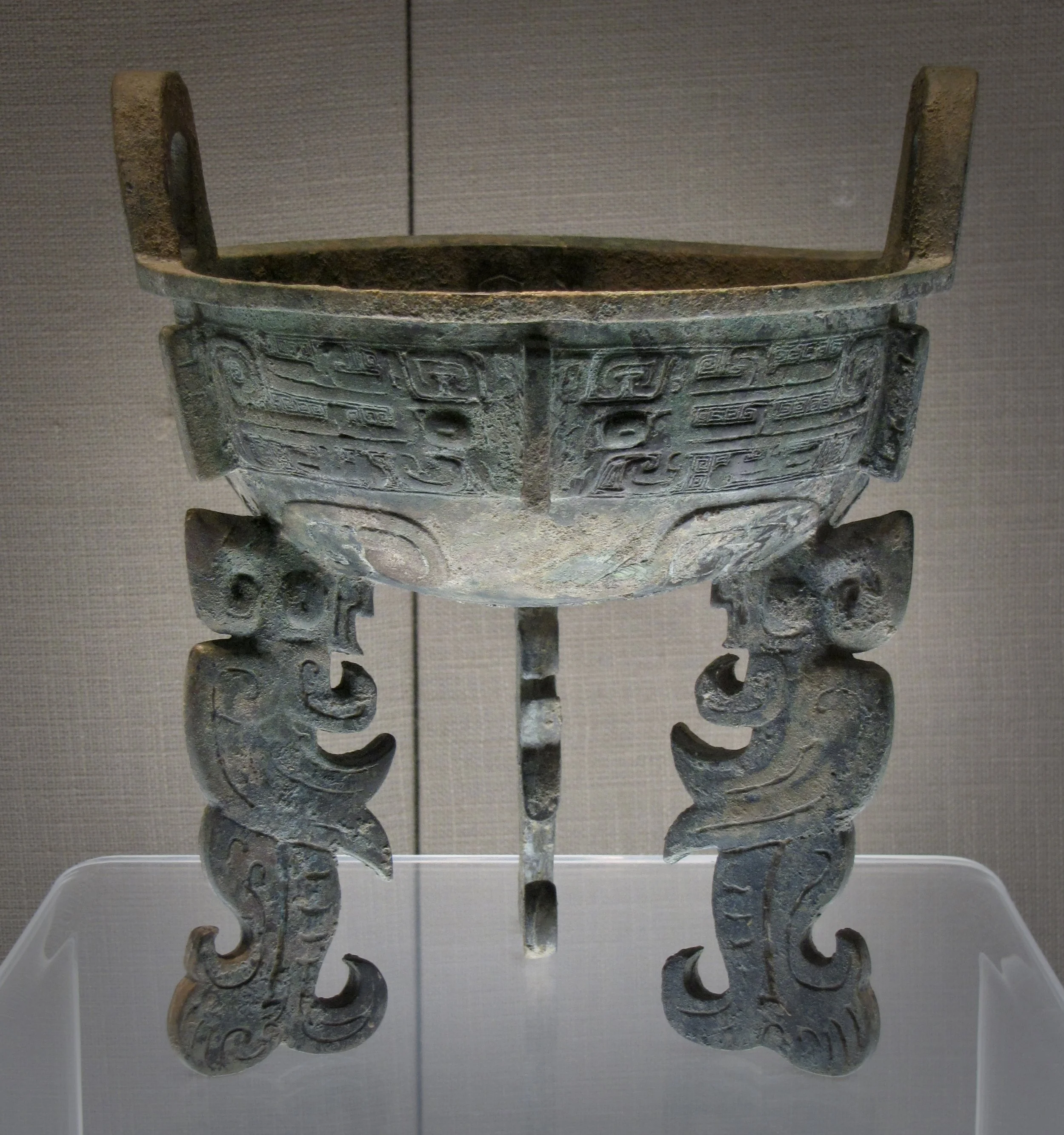 Flat-legged tripod ding with taotie design in the Capital Museum, Beijing. Mid-11th–mid-10th century BCE, Western Zhou period. Photo by Renée DeVoe Mertz.