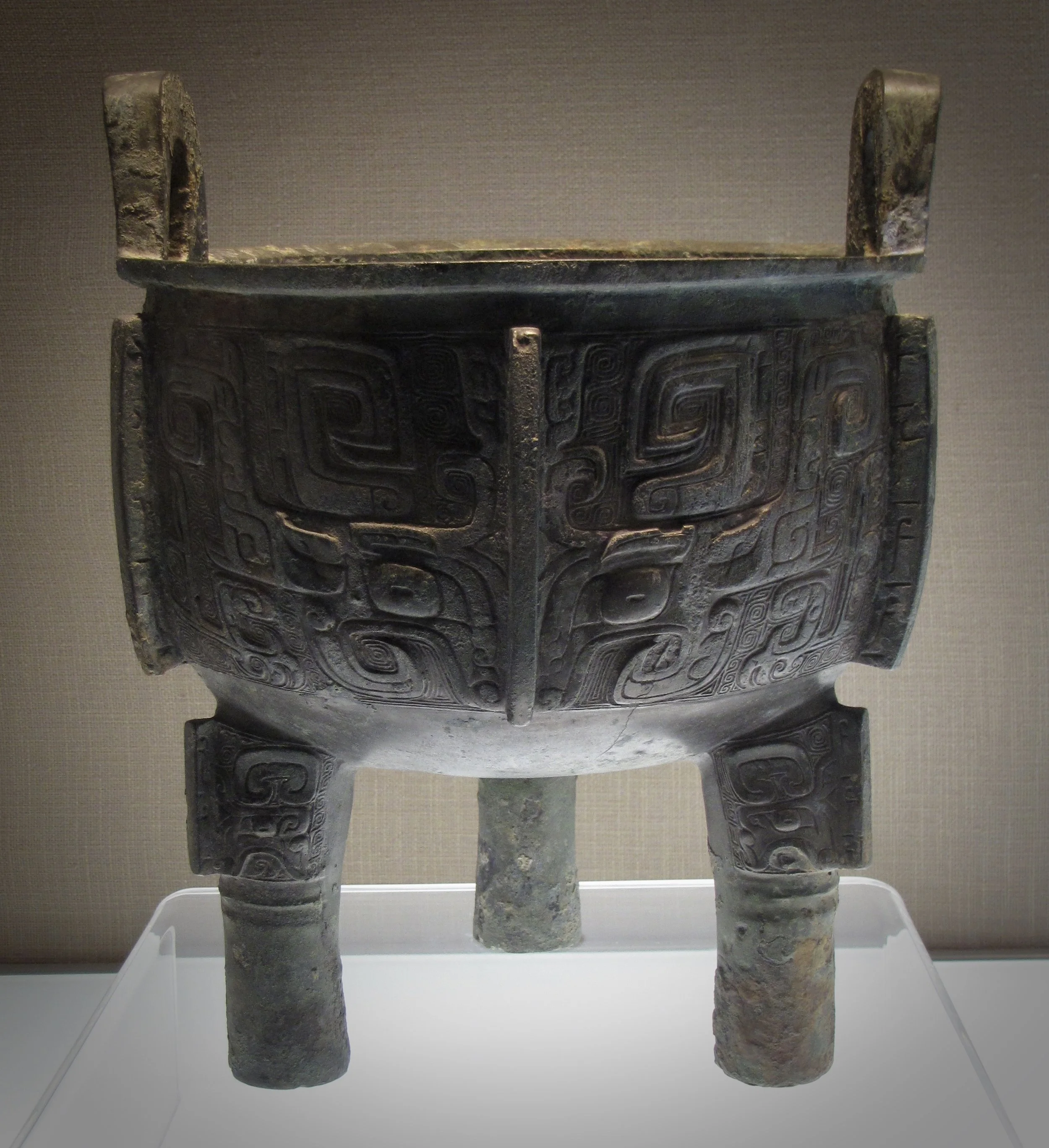Tripod ding with taotie and kui designs in the Capital Museum, Beijing. Mid-11th–mid-10th century BCE, Western Zhou period. Photo by Renée DeVoe Mertz.