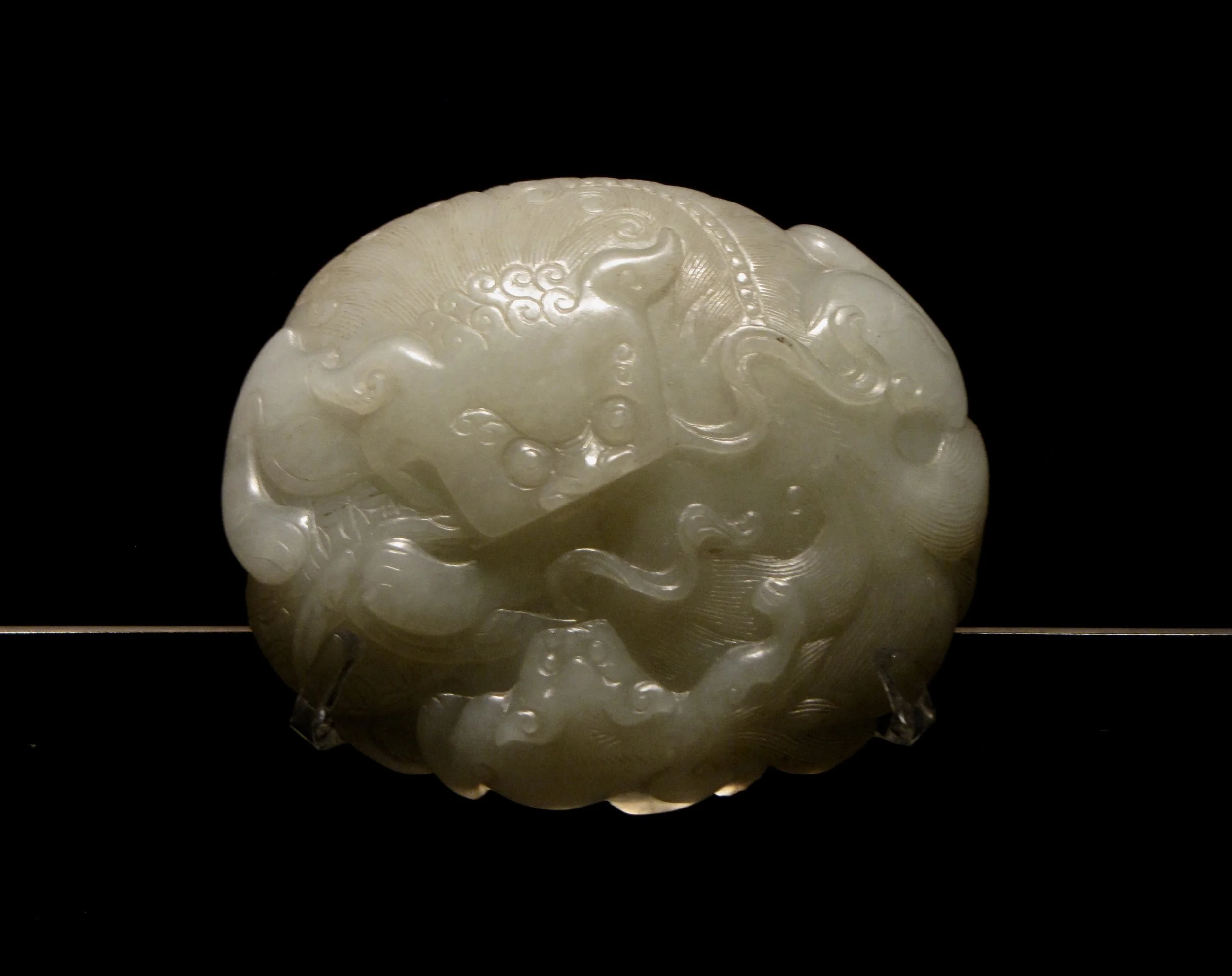 Nephrite belt buckle in the shape of a lion. Capital Museum, Beijing. Photo by Renée DeVoe Mertz.