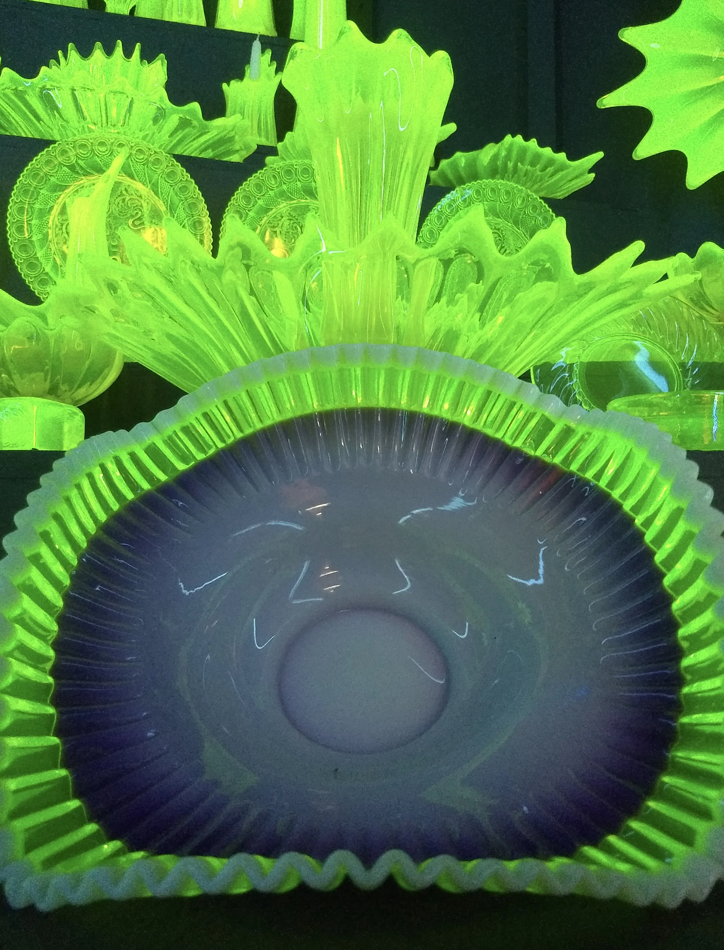 Vaseline glass under black lights. Golden Pioneer Museum. Golden, MO. Photo by Renée DeVoe Mertz.
