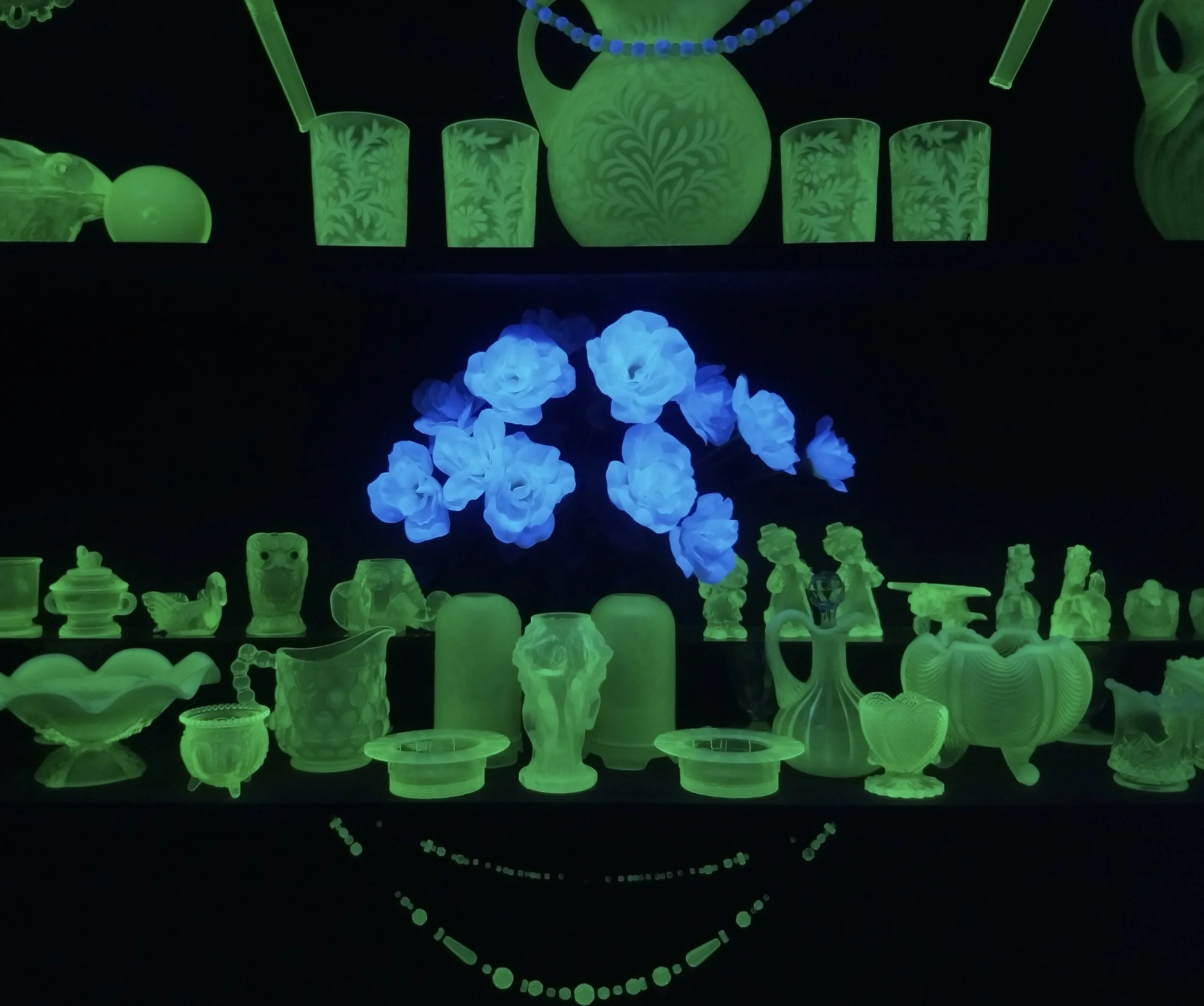 One of multiple black-light rooms with a collection of Vaseline glass at the Golden Pioneer Museum, Golden, MO. Photo by Renée DeVoe Mertz.