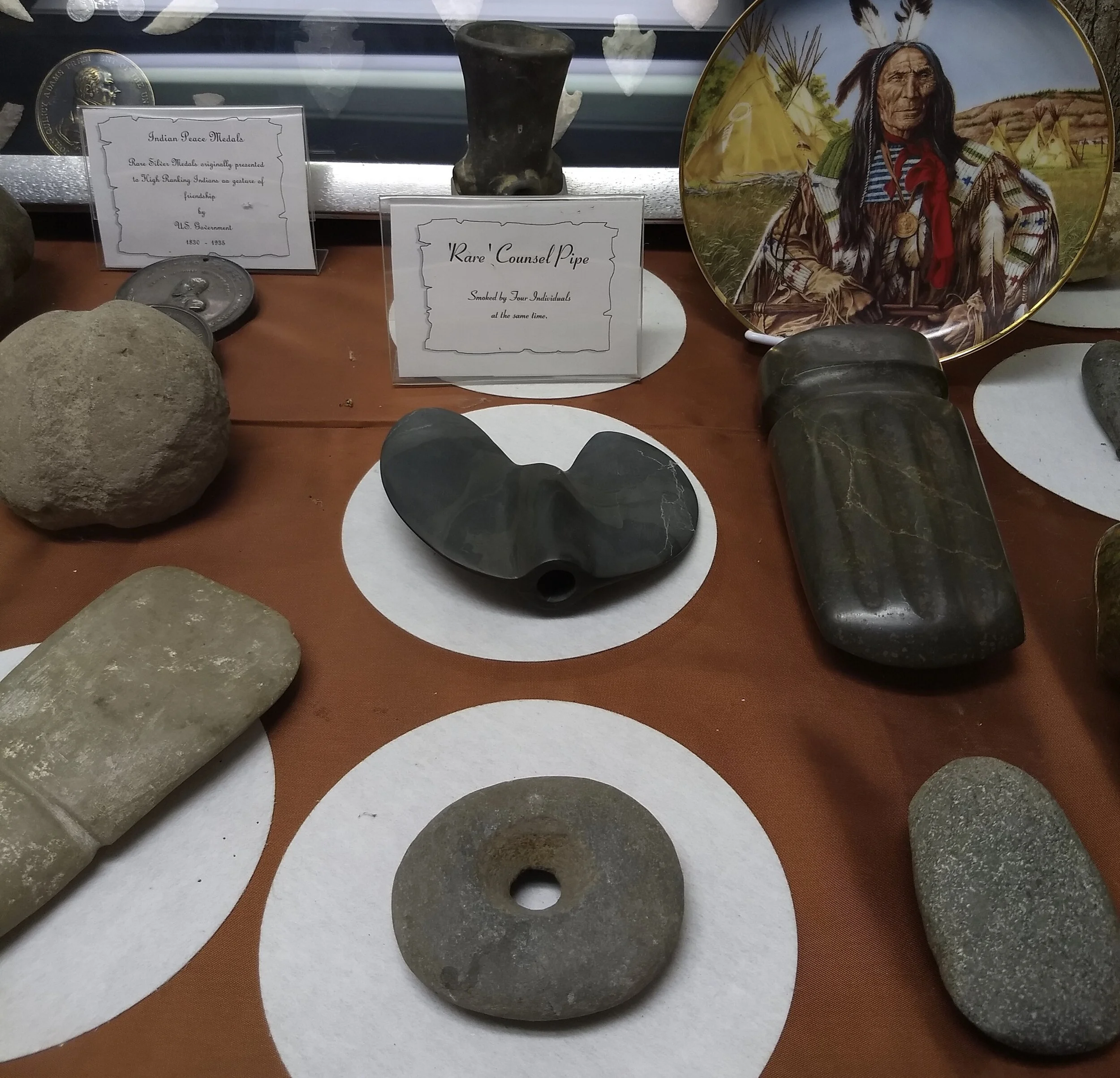 Bannerstone and other Native American stone artifacts, Golden Pioneer Museum. Golden, MO. Photo by Renée DeVoe Mertz.