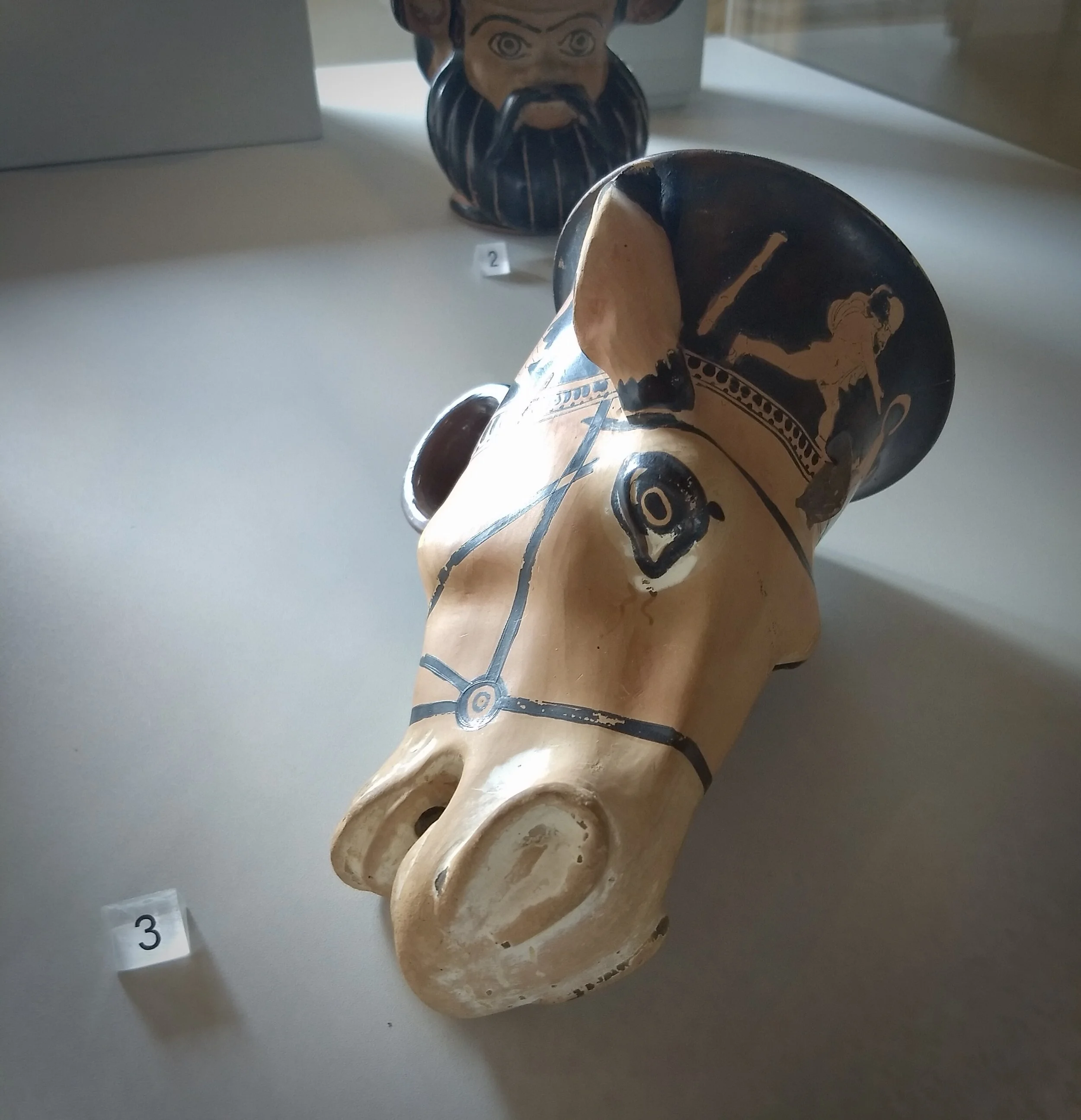 Red-figure attic rhyton in the shape of a mule’s head with a deformed silon on the neck, ca. 430 BCE. Museo Archeologico Nazionale, Ferrara. Photo by Renée DeVoe Mertz.