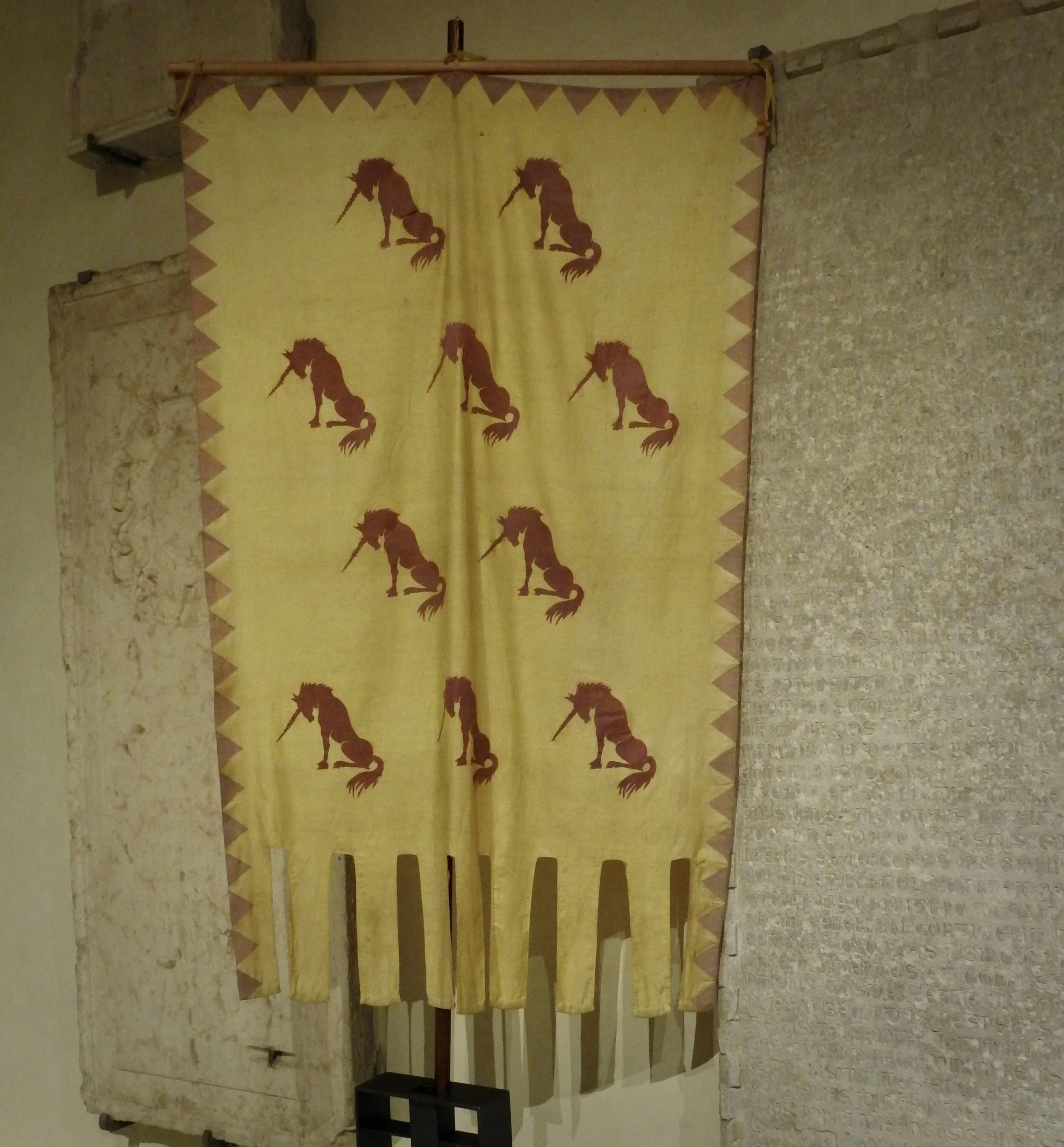 Banner with the Este unicorn on display at Casa Romei, Ferrara. Photo by Renée DeVoe Mertz.