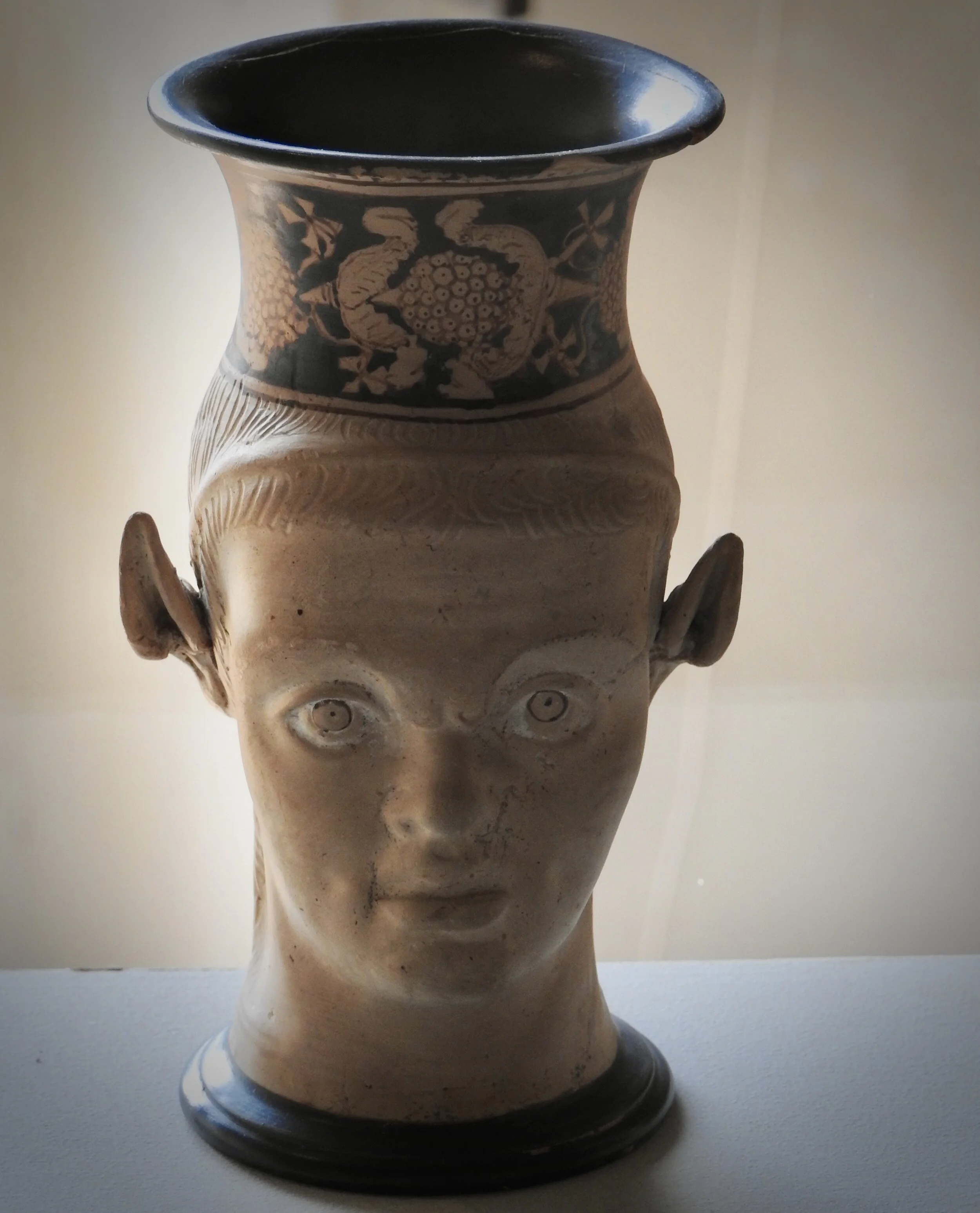 Satyr-head mug. Clusium Workshop, end of the 4th c. BCE. Museo Archeologico Nazionale, Ferrara. Photo by Renée DeVoe Mertz.
