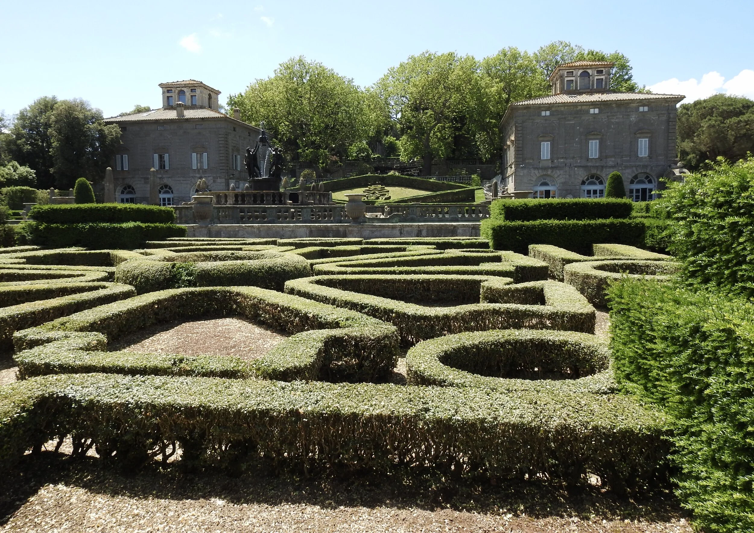 Palazzine Montalto (left) and Gambara (right) rise over Villa Lante’s Fountain of the Square and surrounding manicured garden. Bagnaia, Viterbo, Italy. Photo by Renée DeVoe Mertz.