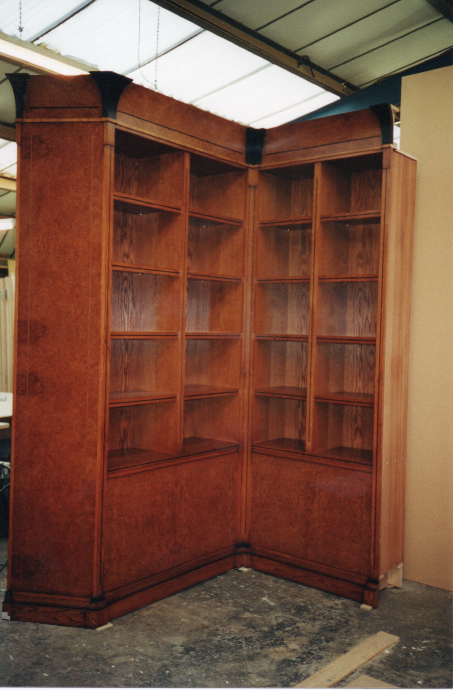 Crown & burr Oak library cabinets with part ebonized cornice